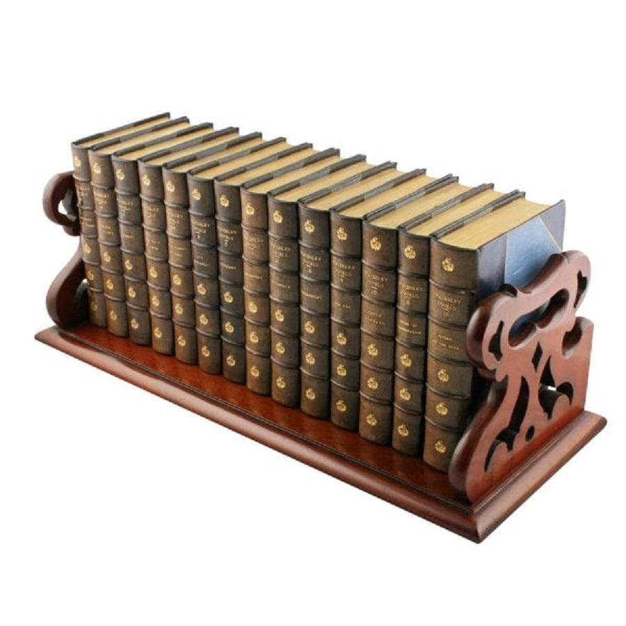 Victorian mahogany book tray



A mid 19th century Victorian mahogany book tray or slide.

The tray has a gallery back and shaped pierced carrying handle ends.

The gallery back has ten baluster shaped turned spindles and a moulded top