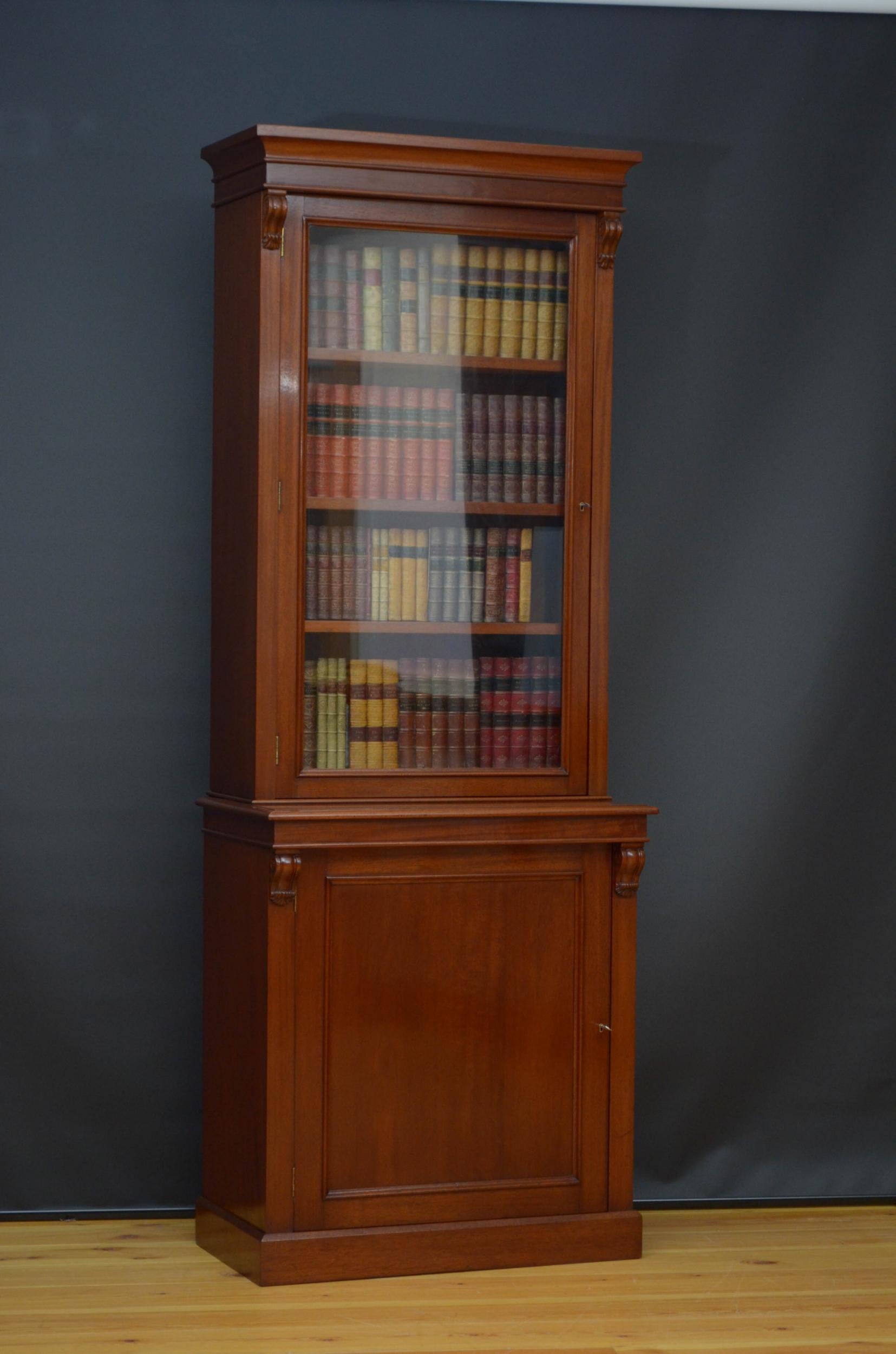 Sn4919 Slim Victorian single door alcove bookcase in mahogany, having outswept cornice above a single glazed door fitted with working lock and a key and enclosing four height adjustable shelves (three on the photos), all flanked by attractive drop
