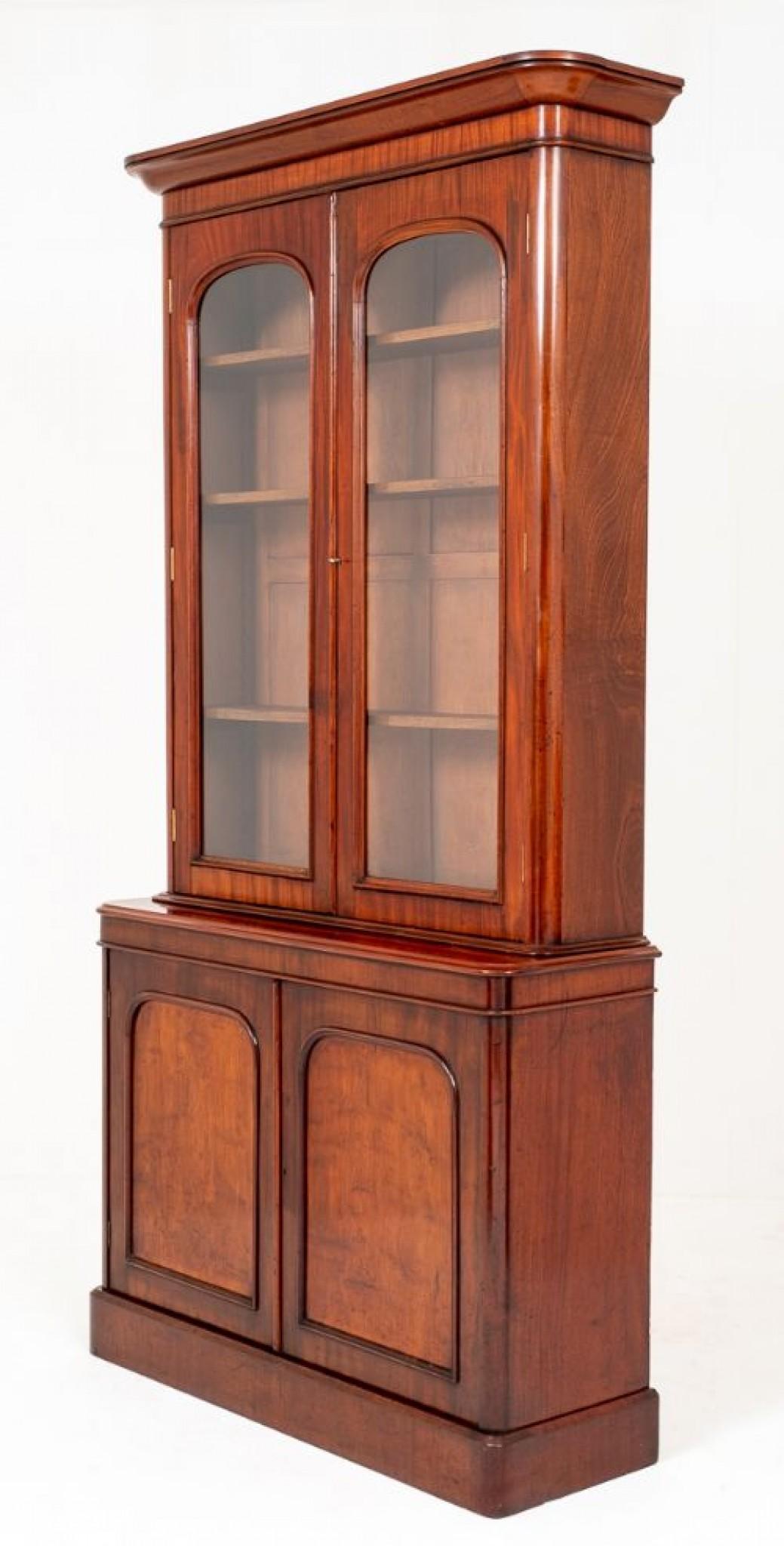 Victorian Mahogany 2 door Glazed Bookcase standing on a plinth base.
The bottom section of the bookcase having panelled doors with 2 adjustable shelves inside.
circa 1860
The upper section featuring 2 Glazed doors also with adjustable