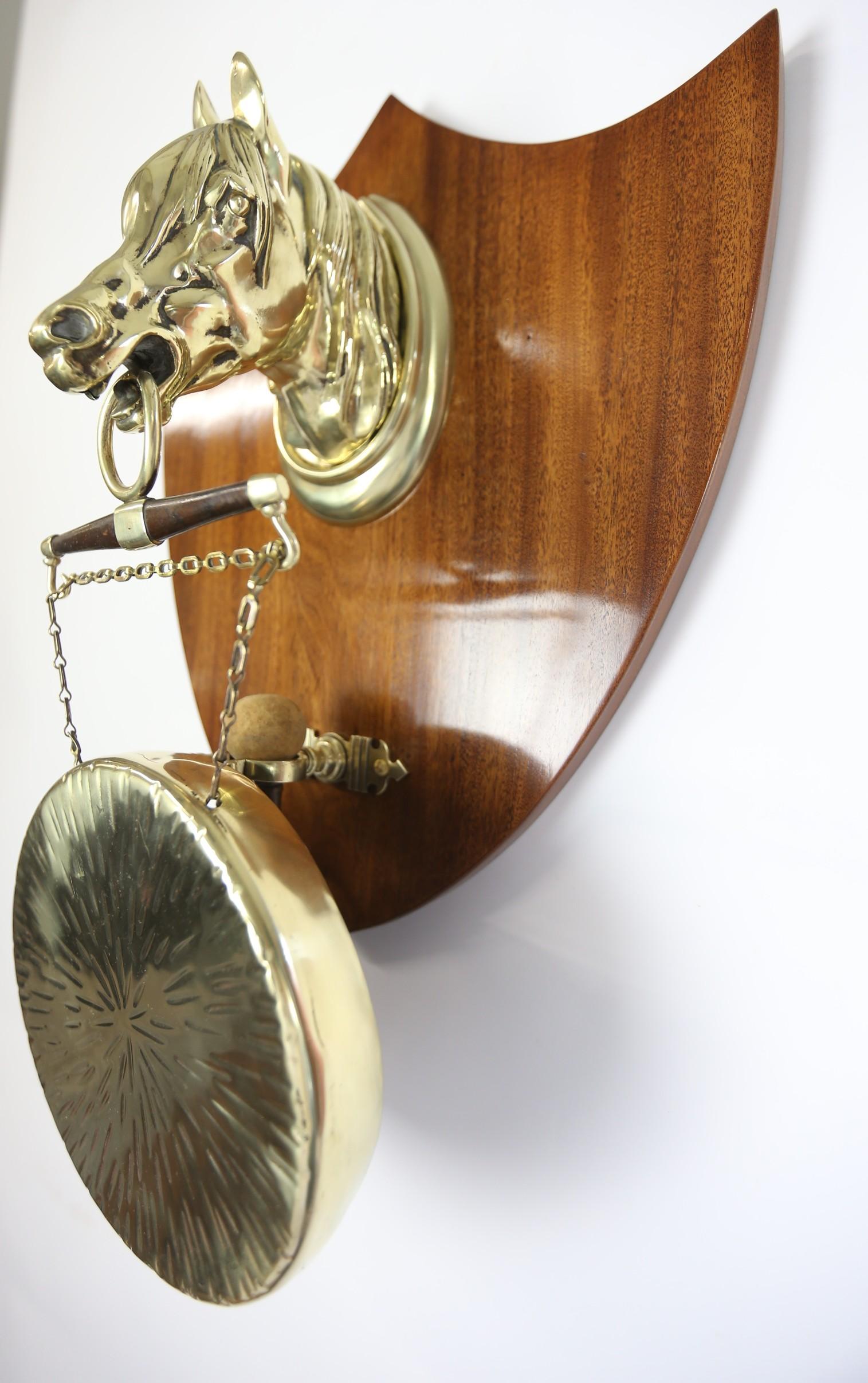 Late Victorian Mahogany & Brass Horse head Wall Mounted  Gong
Mahogany Shield shaped Back, With Mount hook, 
Embossed Hollow Brass Horses Head & Brass Collar
Supporting Circular Brass Gong 
Brass Gong Beater With Bracket Support
Recently Polished