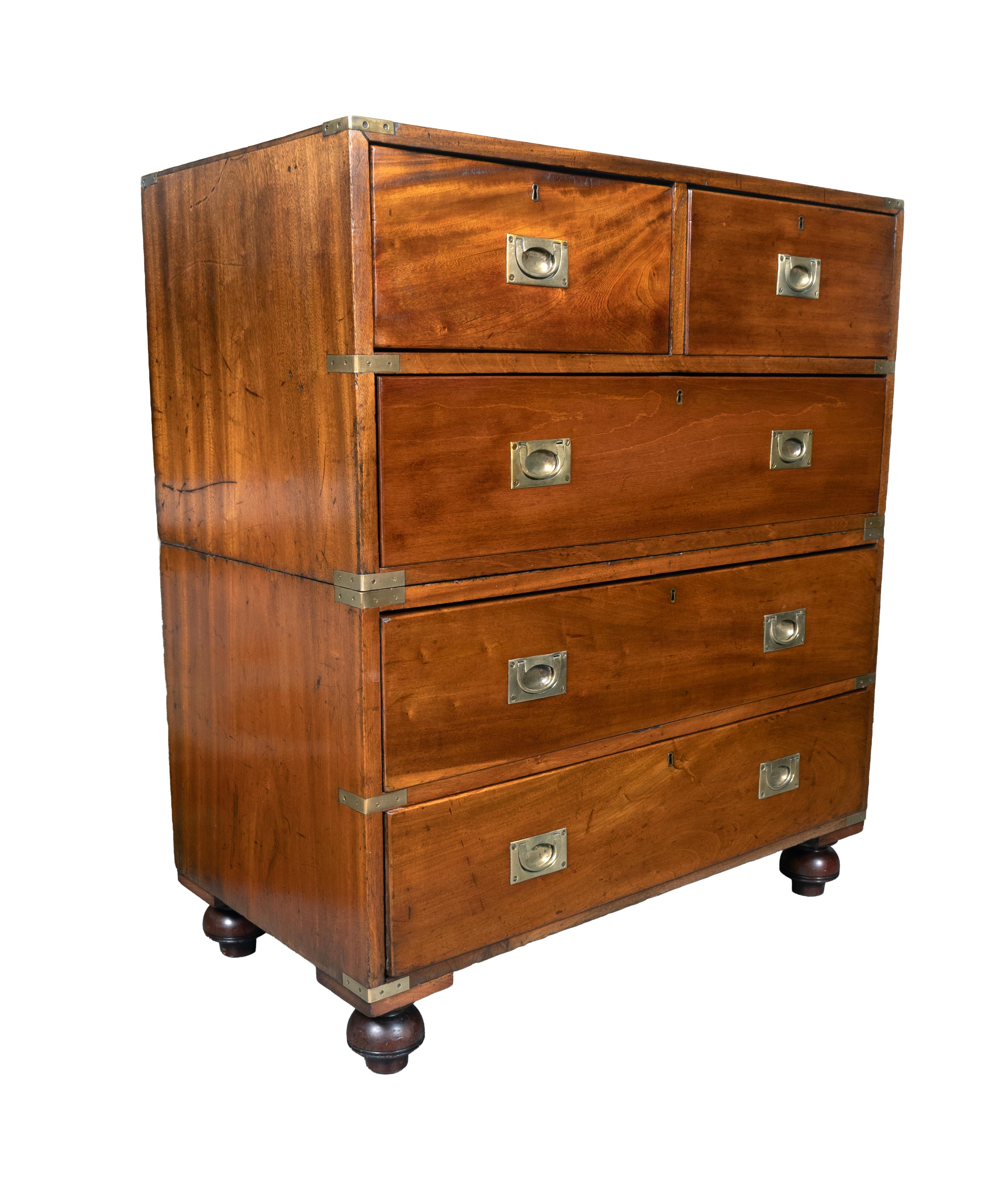 In two parts with brass corners and recessed brass handles. Two over three long drawers. Toupie feet. Retail ready to place.
