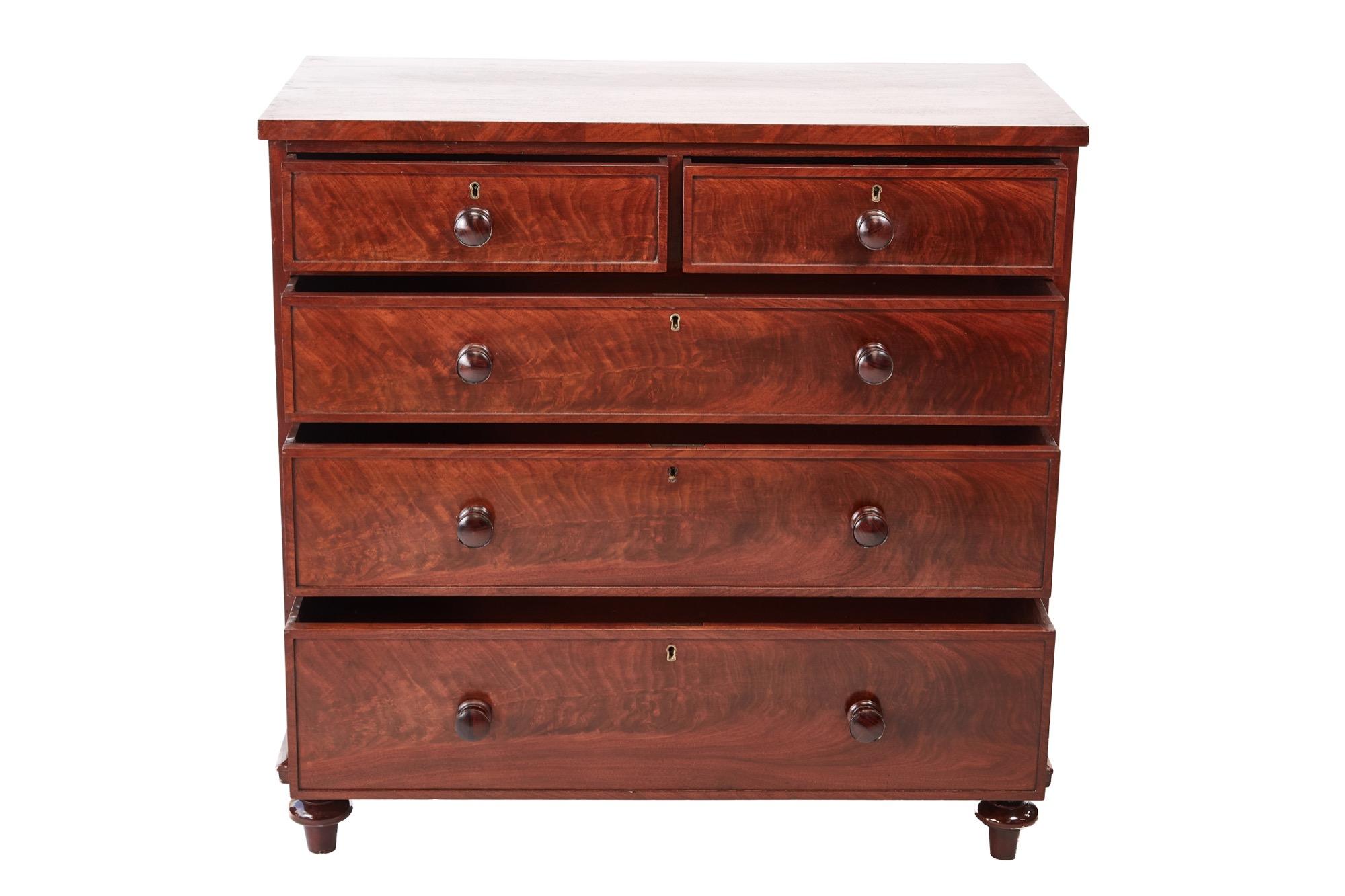 This is a quality 19th century Victorian antique mahogany chest of drawers with a fantastic mahogany top. It has 2 short and 3 long drawers with original turned mahogany knob and moulded drawers fronts. It stands on original turned