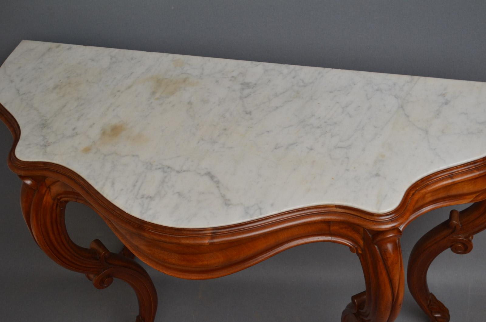 Sn3426, attractive Victorian, mahogany hall table of serpentine design, having original white, veined marble top with moulded edge above shaped, frieze drawer, all raise on 4 carved, cabriole legs. This antique hall table has been sympathetically