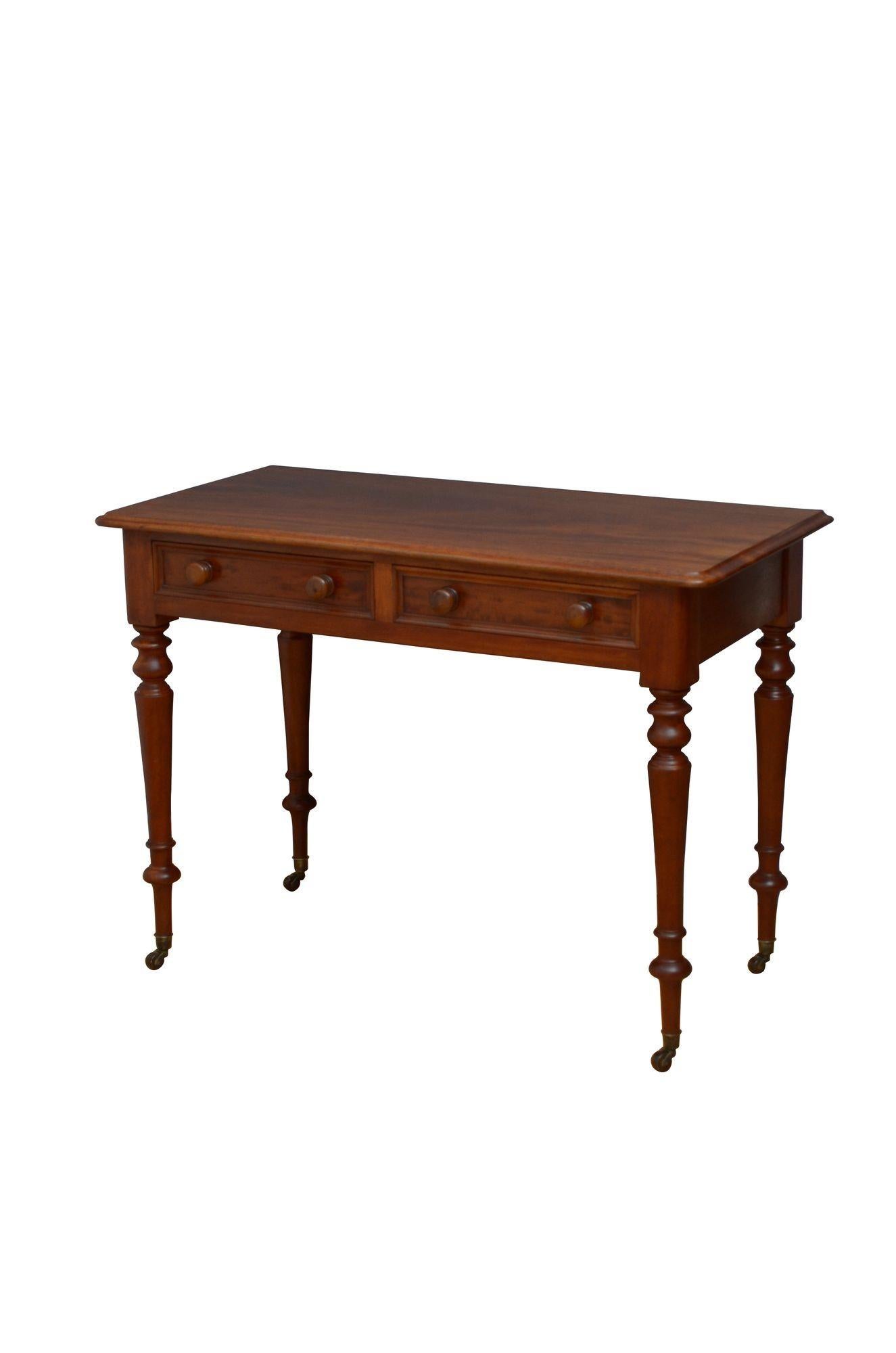 k0273 Fine quality, solid mahogany Victorian side table / writing table / dressing table, having figured, solid mahogany top with moulded edge above two oak lined drawers with moulded edge and original turned knobs, all standing on slender turned