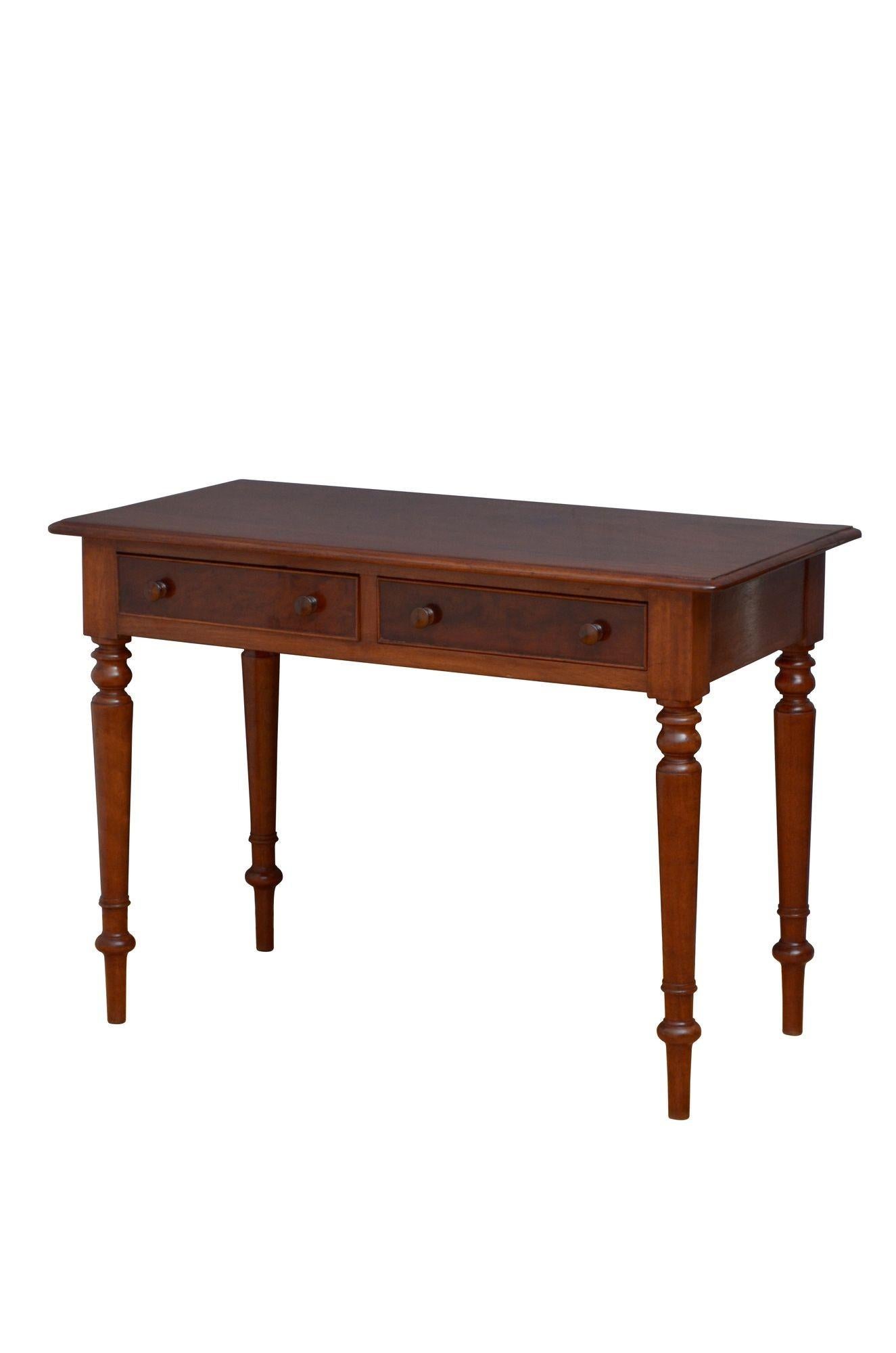 K0272 Fine quality, solid mahogany Victorian side table / writing table / dressing table, having figured, solid mahogany top with moulded edge above two oak lined drawers fitted with cockbeaded edge and turned knobs, all standing on slender turned