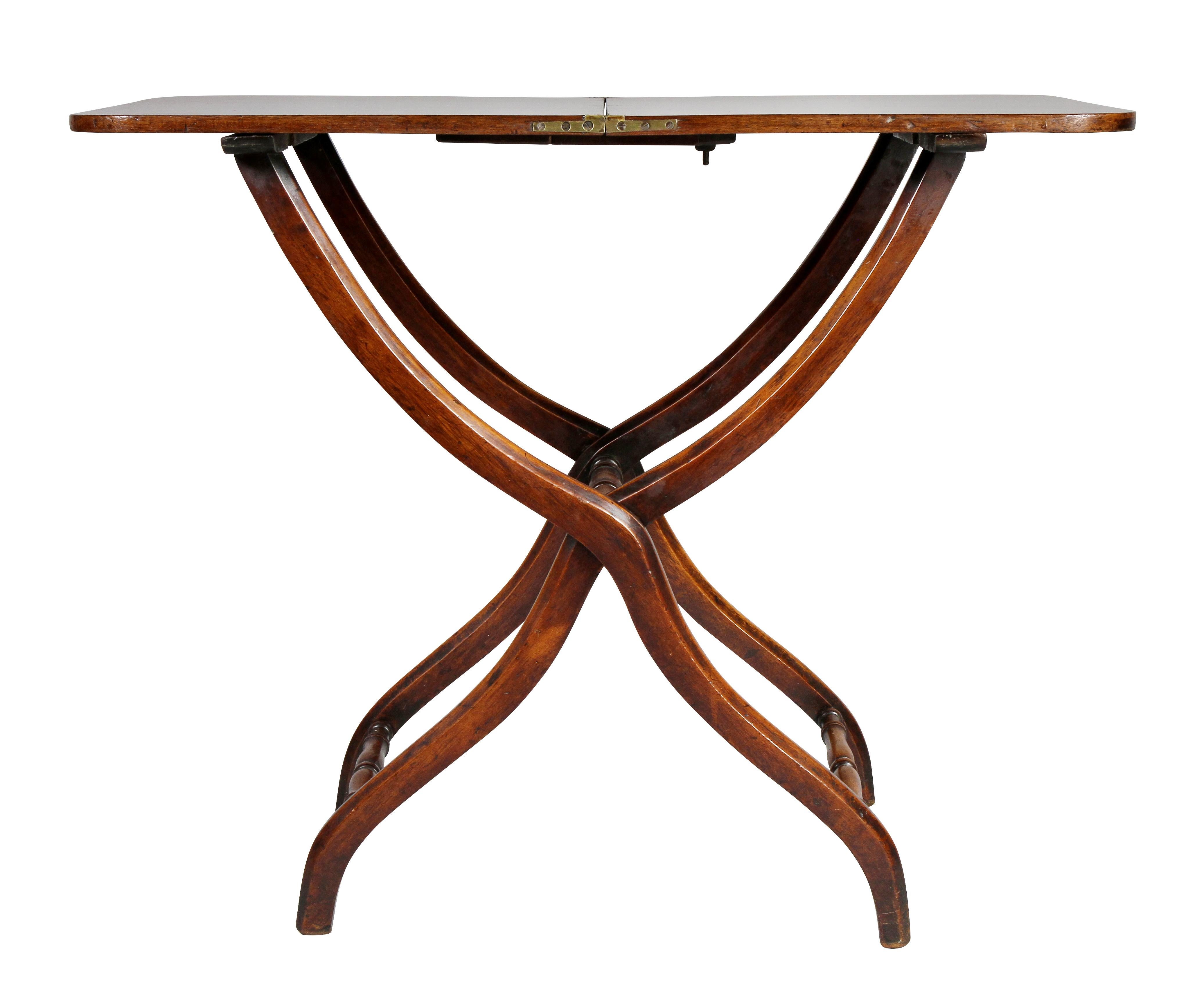 Rectangular top that folds with an X form base.