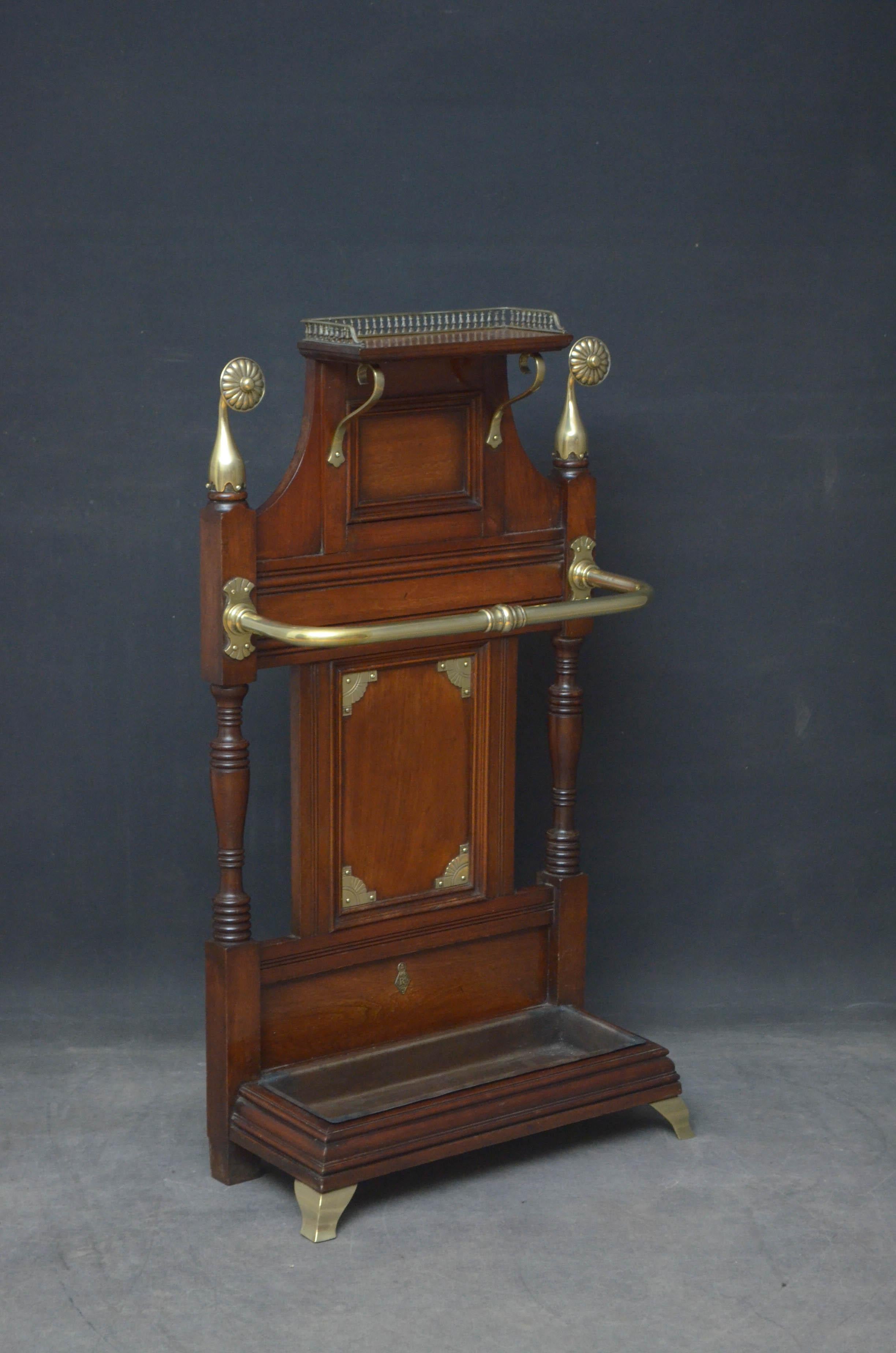 Sn4808 Stylish Victorian umbrella stand in the manner of James Schoolbred, having brass gallery to the shelf over moulded recessed panels and turned columns all fitted with decorative brasses and original drip tray, all in excellent original