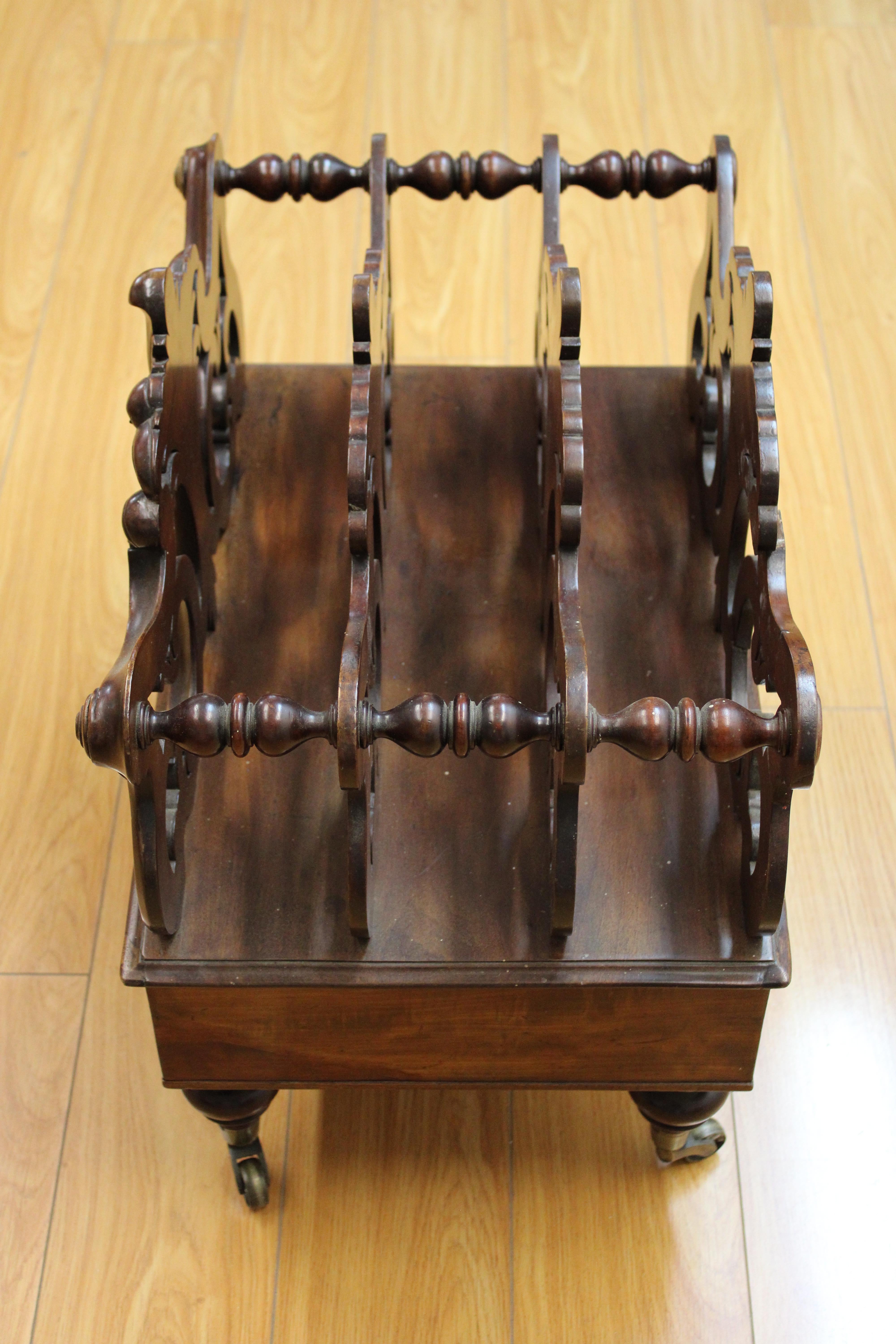 C. 20th Century

Victorian mahogany hand carved canterbury w/ drawer & brass wheels.