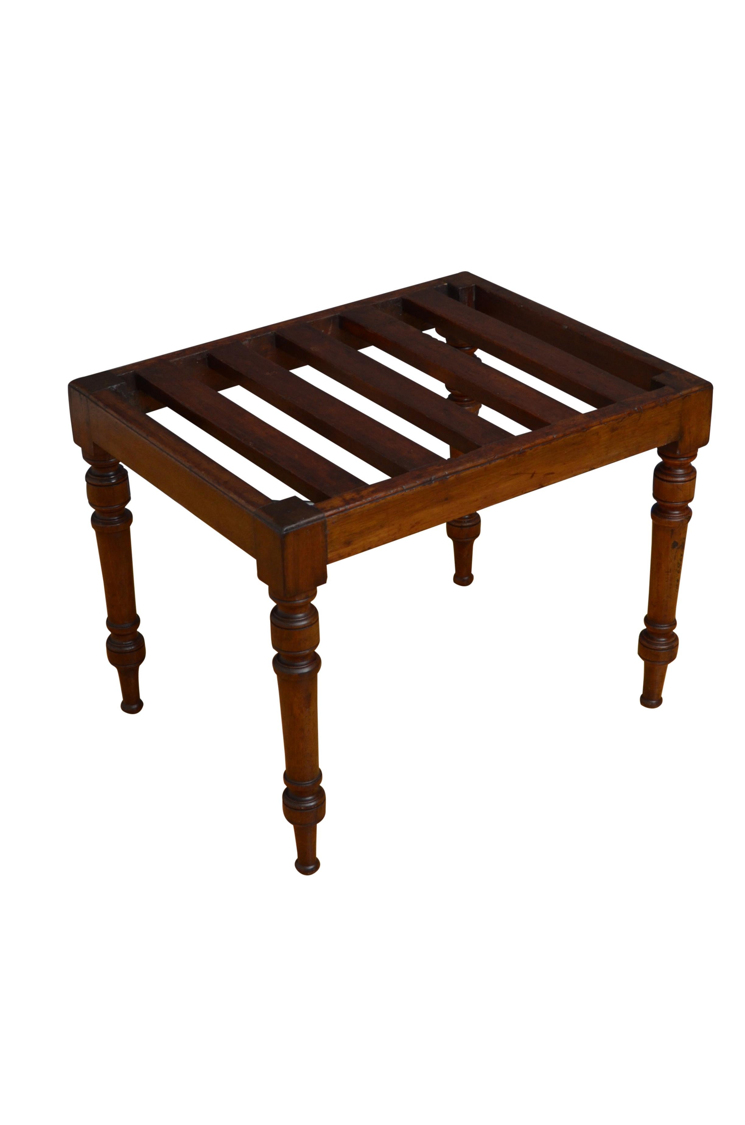 Victorian solid mahogany luggage rack with sturdy slats and turned legs. This antique luggage rack would make a good hall seat. All in home ready condition retaining original finish and good patina. c1860
H18