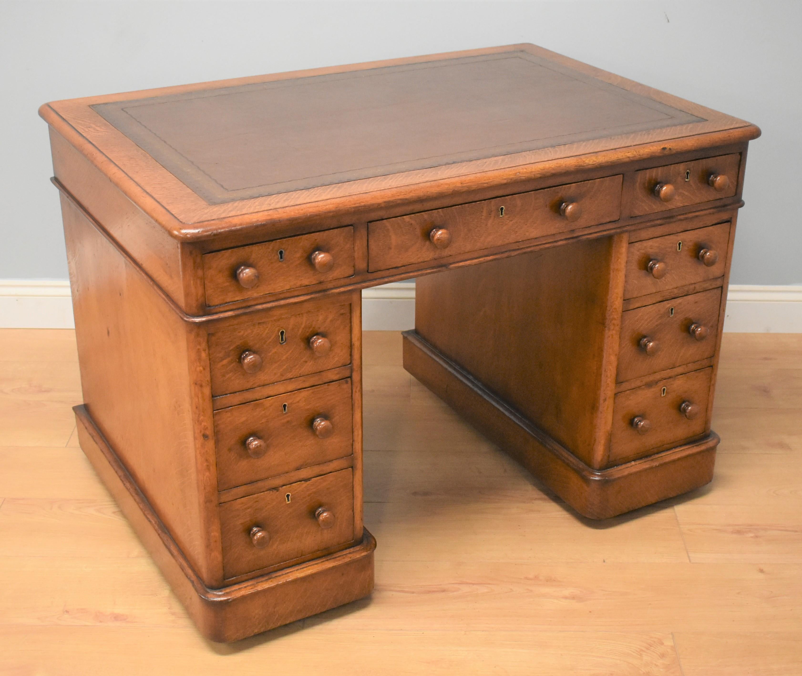 Victorian oak pedestal desk in good condition having been restored and polished by traditional methods. The leather has also been replaced to a brown leather with gold tooling to the edge. The desk has one long centre drawer with two short either