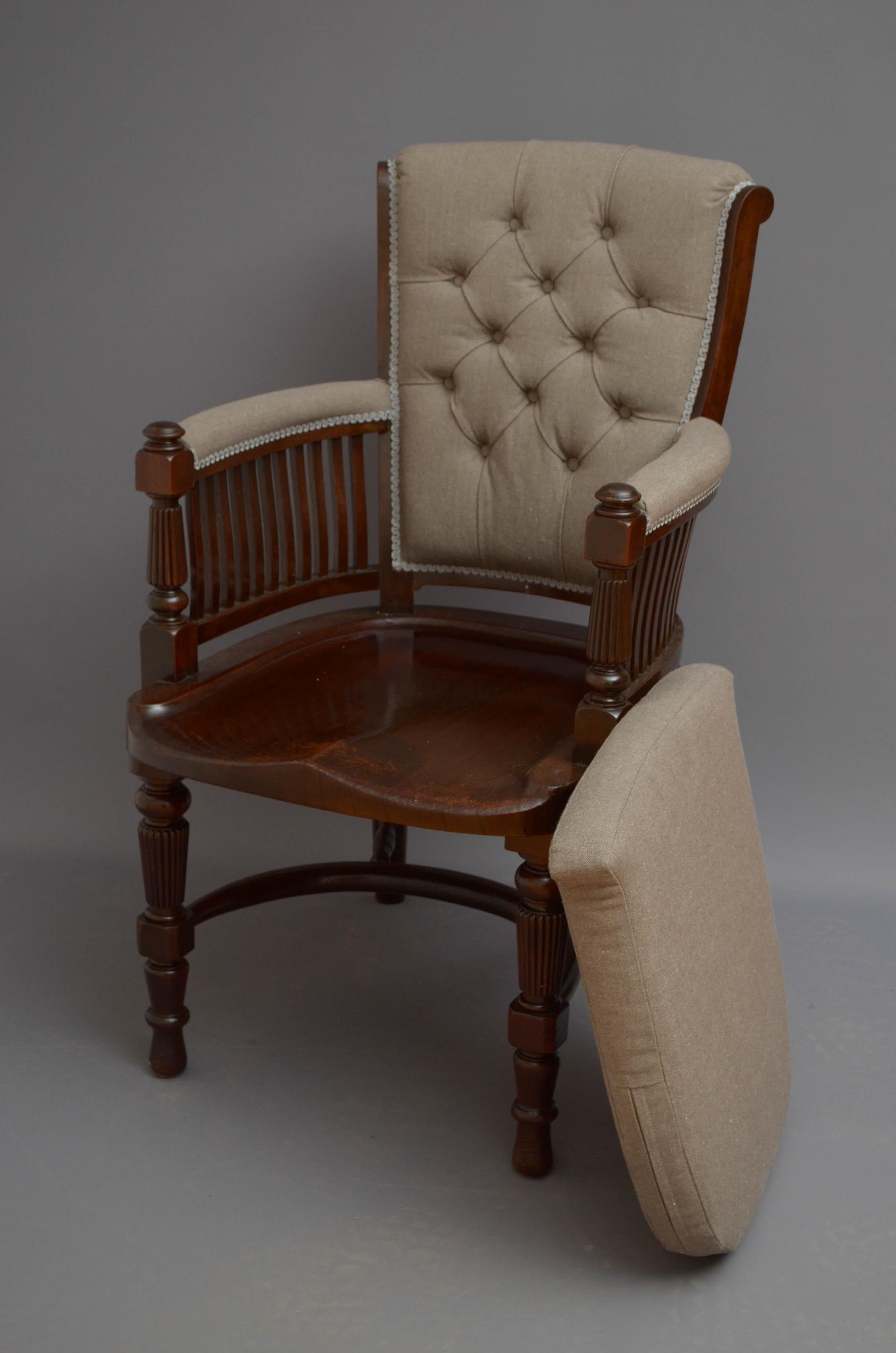 Sn5158 A substantial Victorian desk chair in mahogany, having button upholstered back, padded arms and generous seat with cushion, all standing on turned and reeded legs united by crinoline stretchers. This antique chair is in excellent home ready