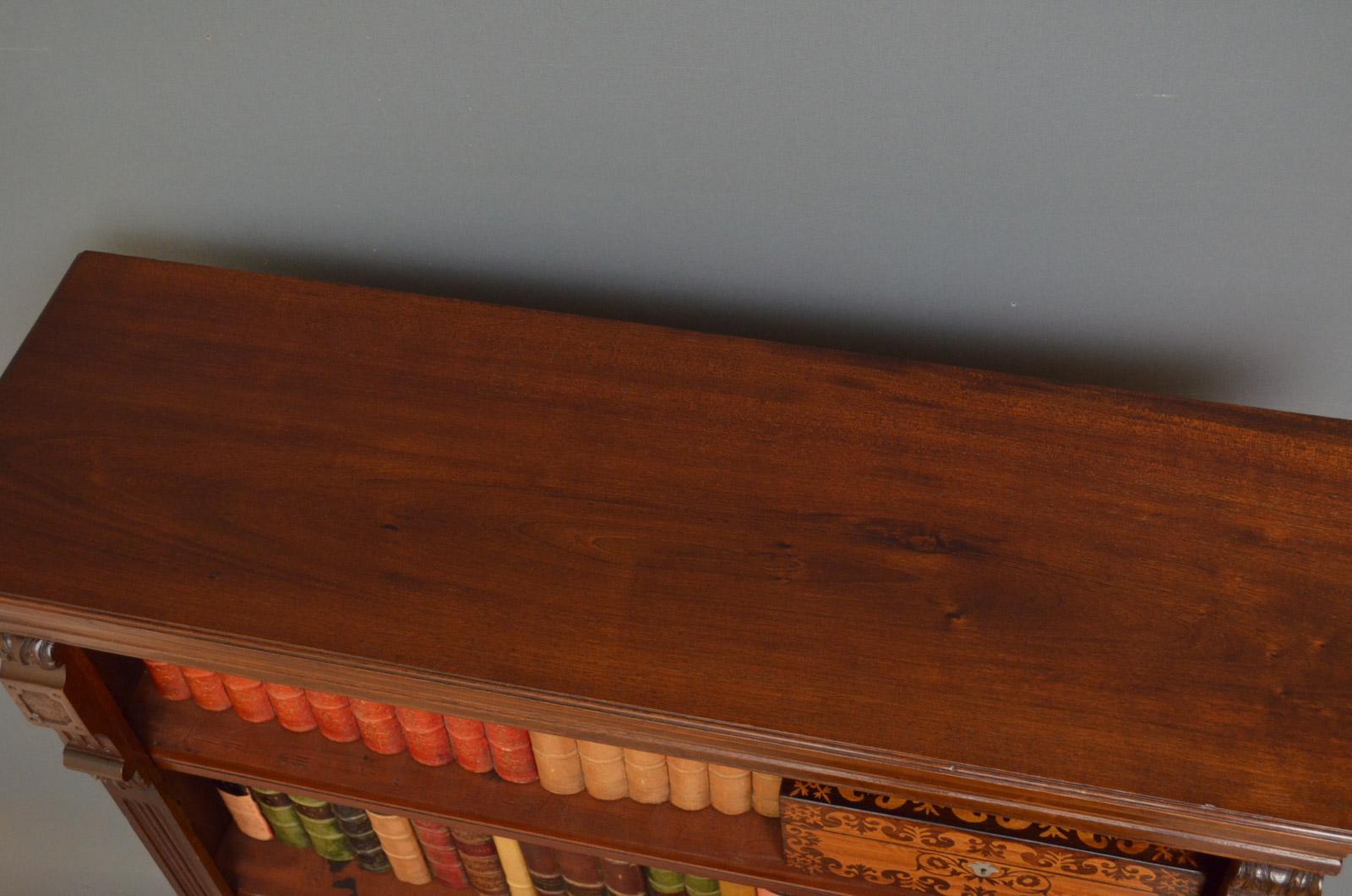 Sn4487 Late Victorian open bookcase in mahogany, having molded top above 3 height adjustable shelves with reeded edges, flanked by drop carvings and reeded pilasters, all standing on plinth base. This antique bookcase is in home ready condition,