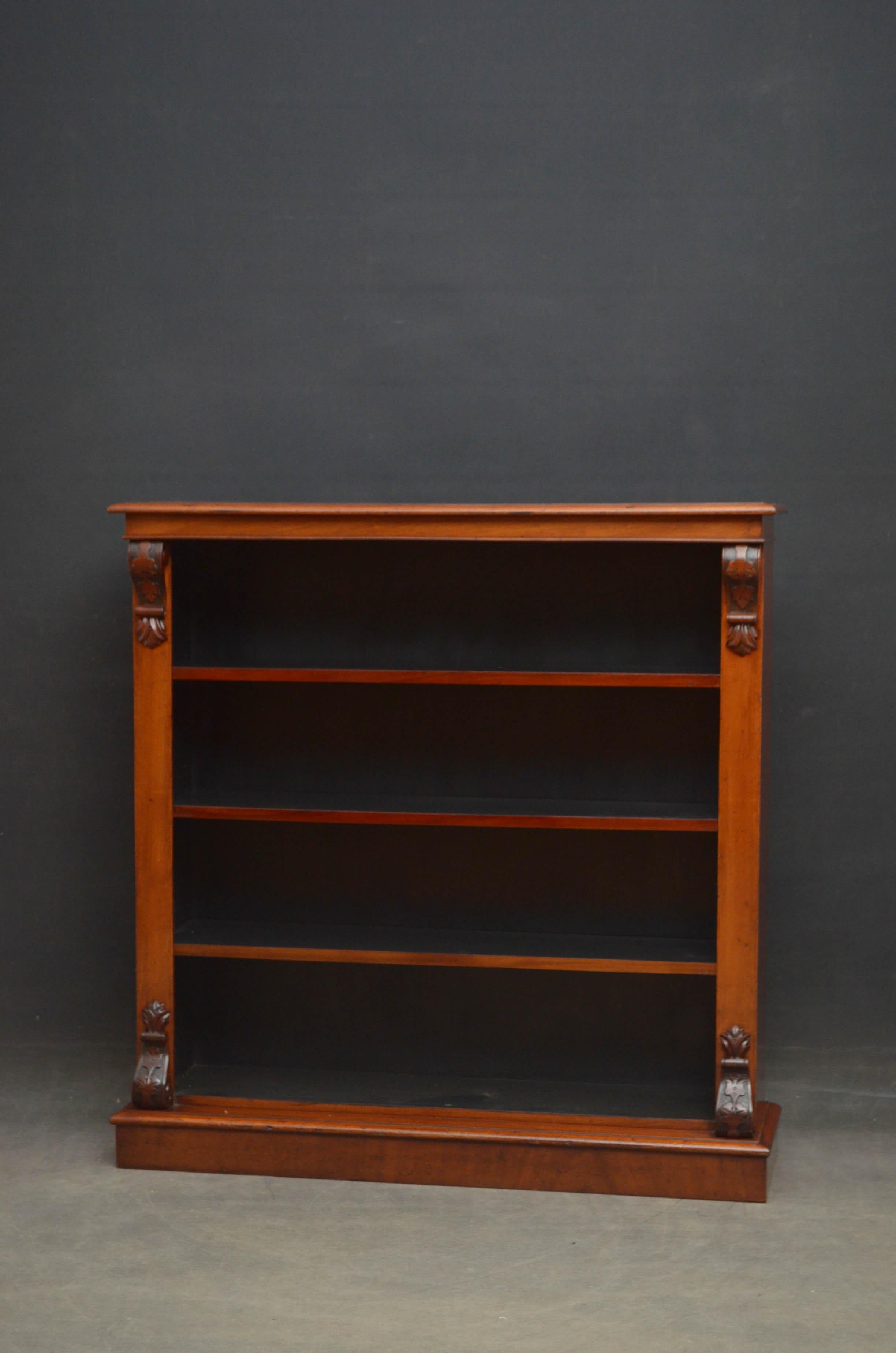 Sn4680 Victorian mahogany open bookcase in light to medium mahogany, having moulded top above 3 height adjustable shelves flanked by Fine quality drop carvings to top and base, all standing on moulded plinth base. This antique bookcase retains its