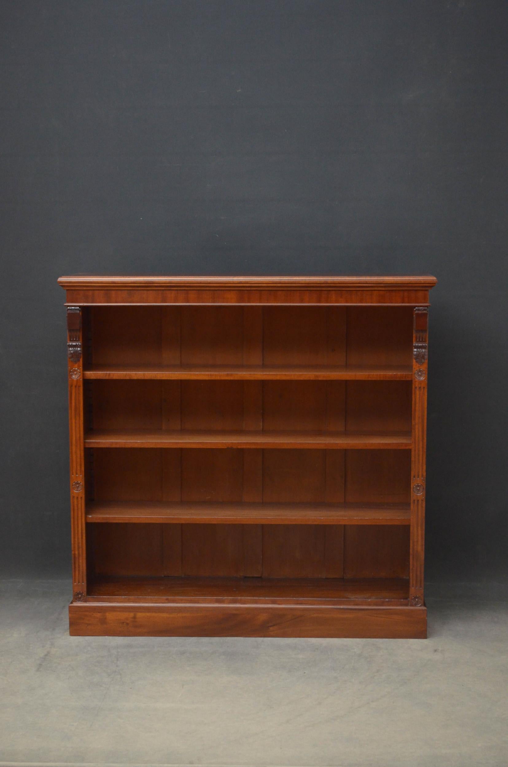Sn4754, fine quality Victorian open bookcase in mahogany, having very attractive figured mahogany sides and figured mahogany top with moulded edge, above three height adjustable shelves all flanked by drop carving, reeded pilaster and carved