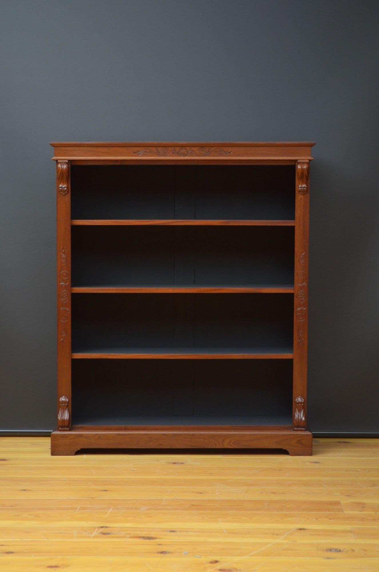 Sn5284 Victorian open bookcase in mahogany, having figured top above a decorative frieze and three height adjustable shelves, all flanked by drop carvings to the top and base, standing on shaped plinth. This antique bookcase has been sympathetically