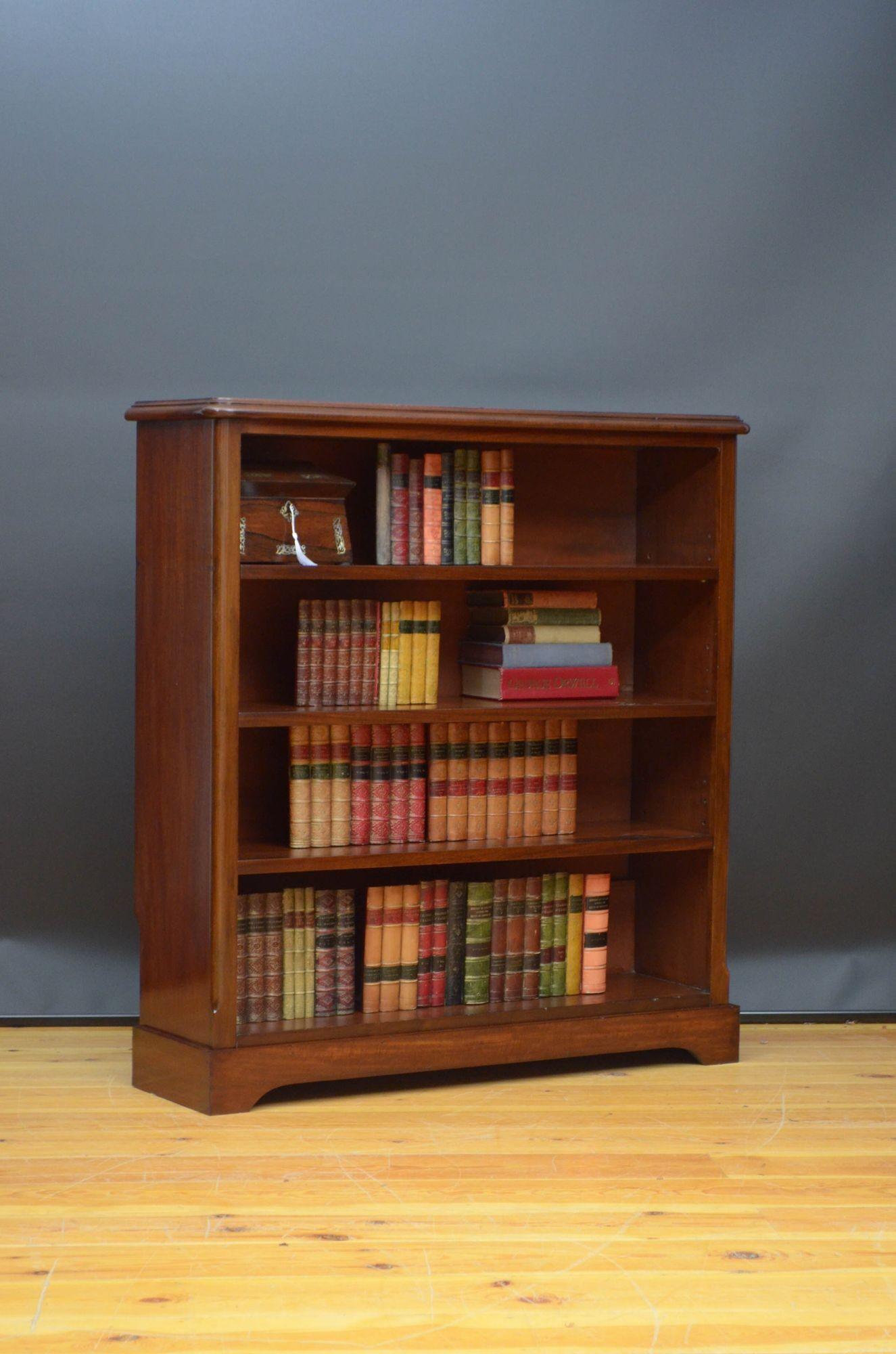 Sn5517 Victorian, mahogany open bookcase of round shoulder design, having figured mahogany top with moulded edge above three height adjustable shelves, all standing on shaped plinth base. This antique bookcase is in home ready condition. c1860
H44