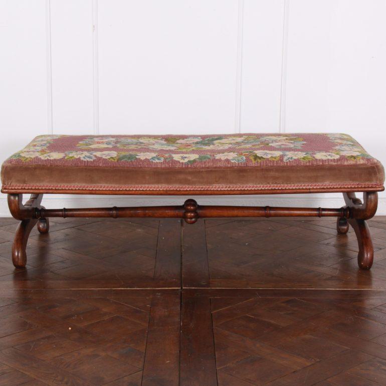 An English Victorian mahogany-frame ottoman with needle point upholstery, the legs are of a scrolled ‘X’ design and united by a turned stretcher, circa 1860.


             
                      