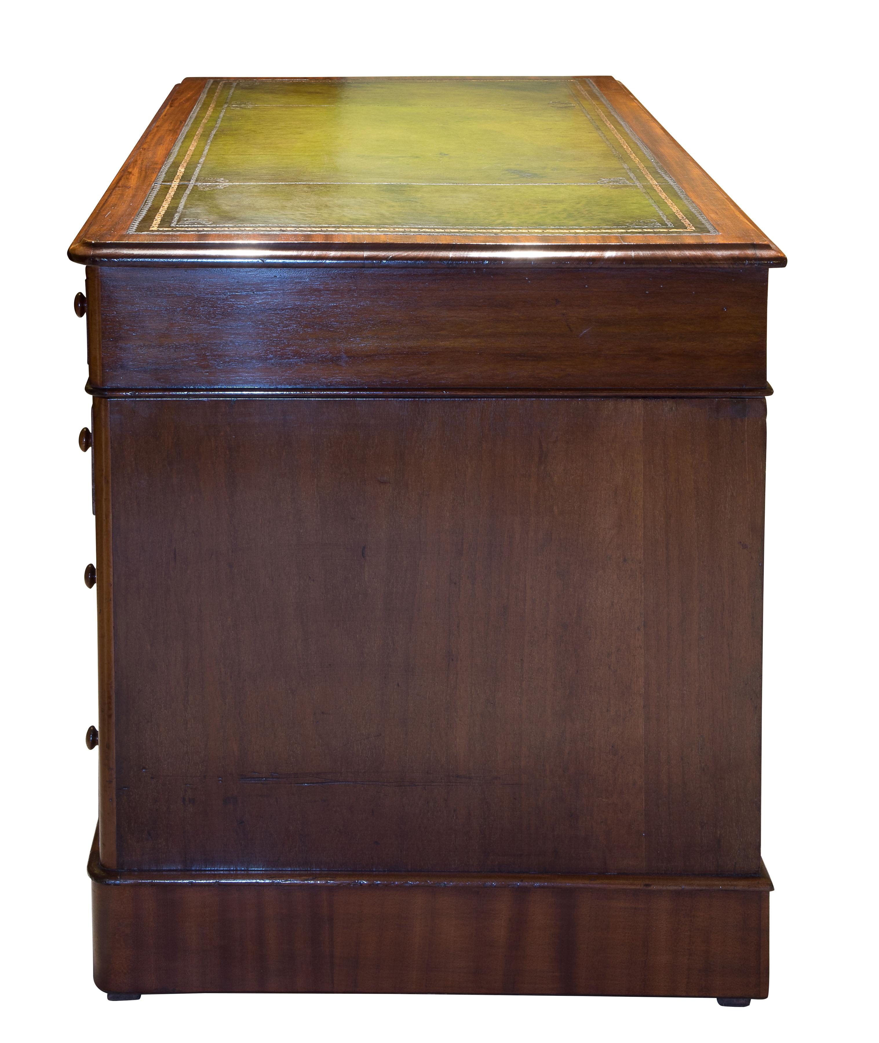 A Victorian mahogany pedestal desk of 9 drawers. Rounded corners and green leather inset top,

circa 1880.