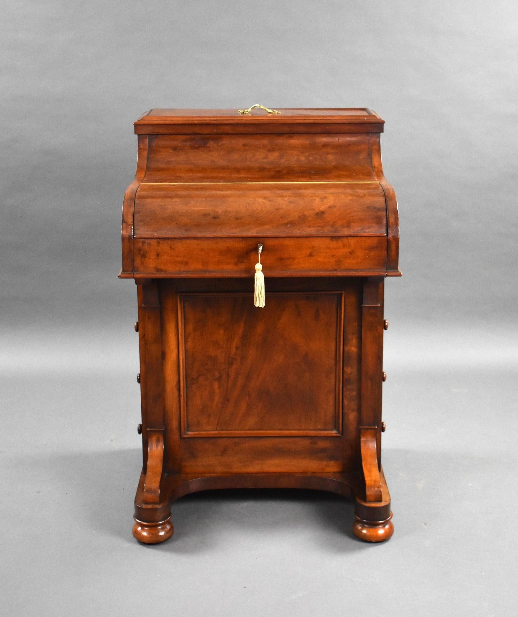 For sale is a very good quality Victorian mahogany davenport by J Ride, Croydon, having a piano top, opening to reveal an adjustable writing surface and drawers, the right hand of which has a secret button which activates the 