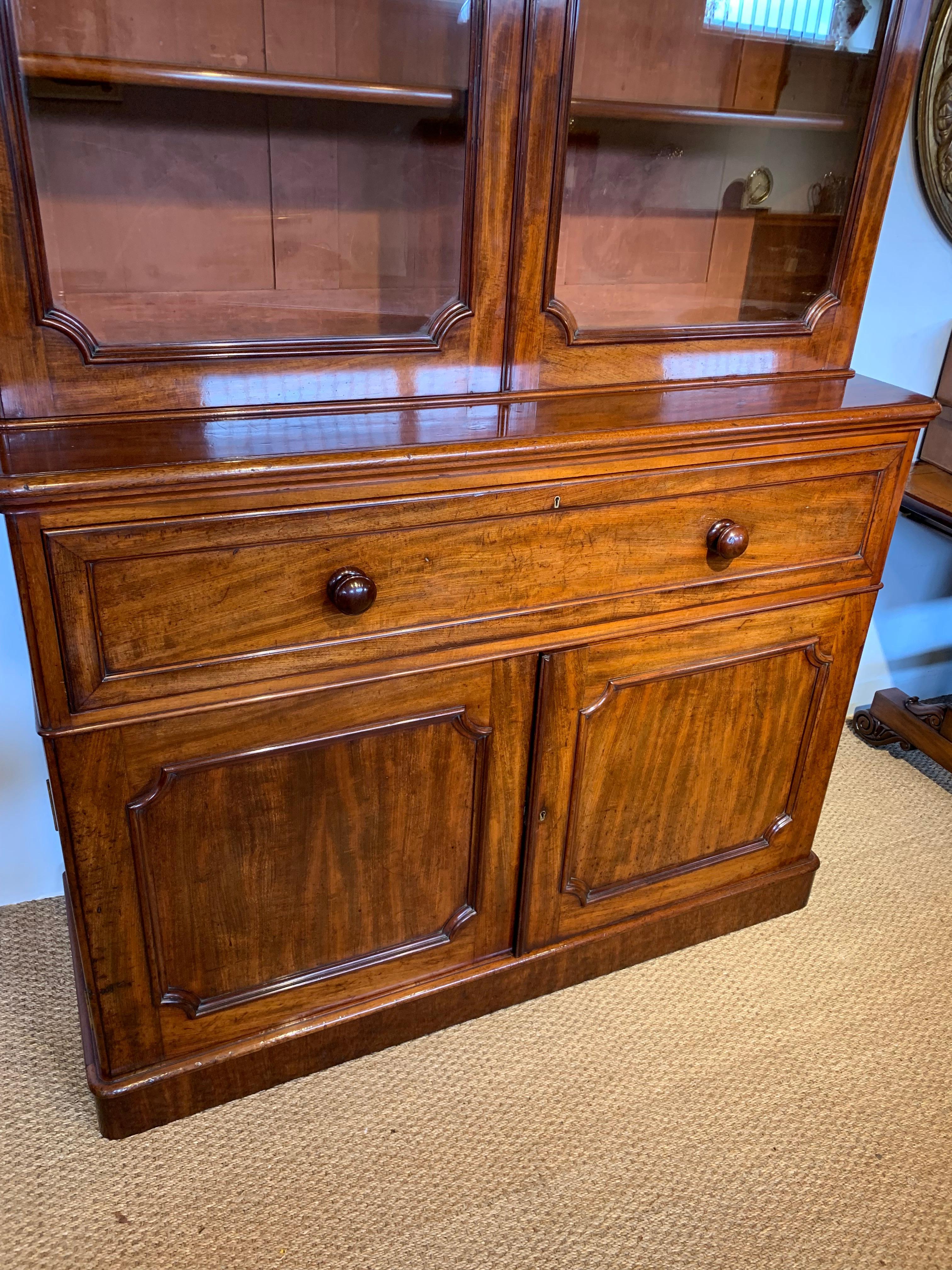 Very good quality mid-19th century mahogany secretaire bookcase 

English circa 1860s makers stamp on the drawer and various brass plaques on the back of the piece 

Original glass , replacement leather , all the shelves in the top section are