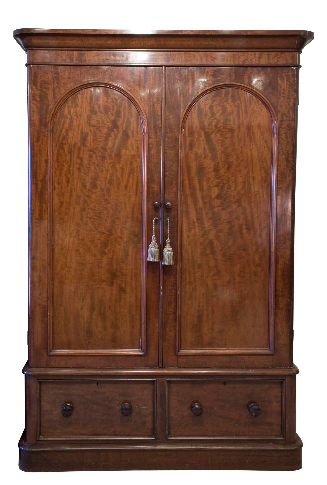 A Victorian mahogany 2-door wardrobe with 2-drawers under, circa 1870.


   