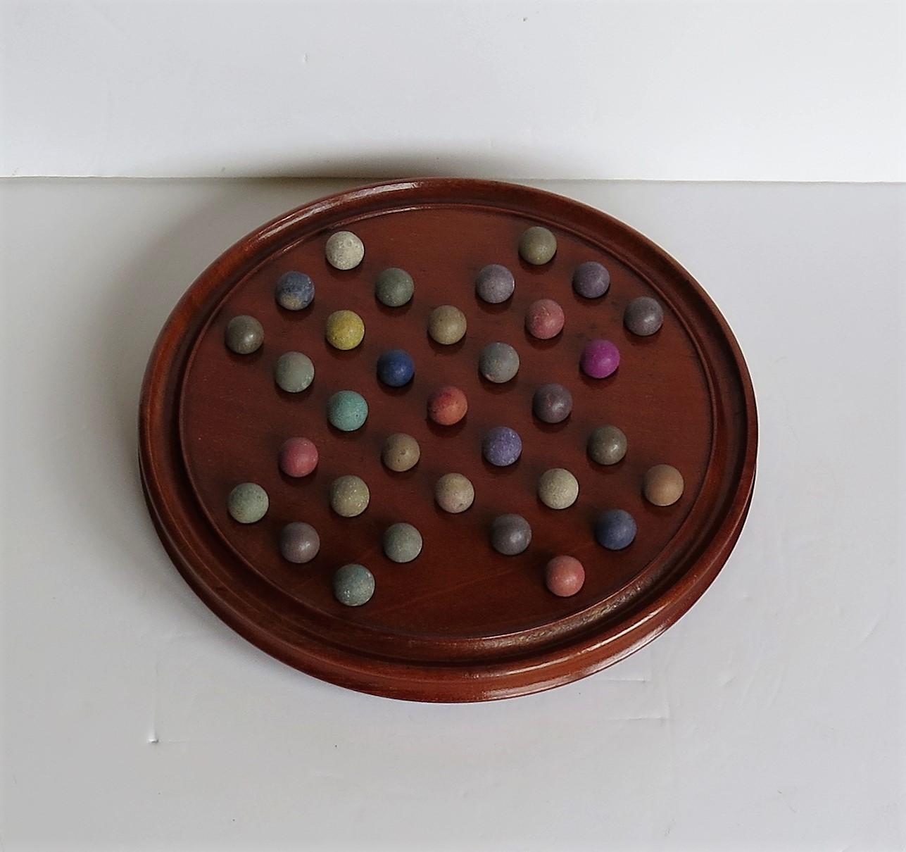 Folk Art Victorian Marble Solitaire Fine Hardwood Board with 33 Clay and Stone Marbles For Sale