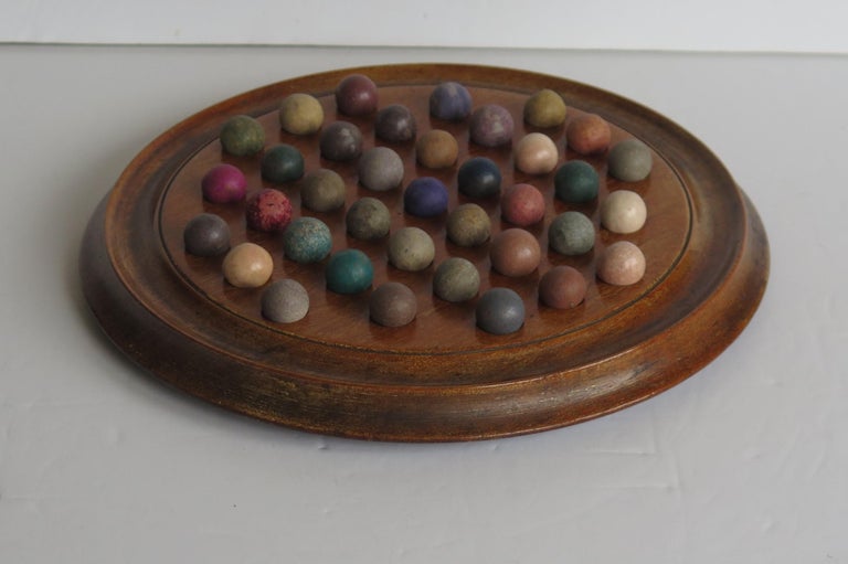 British Victorian Marble Solitaire Game Hardwood Board 37 Handmade Clay or Stone Marbles For Sale