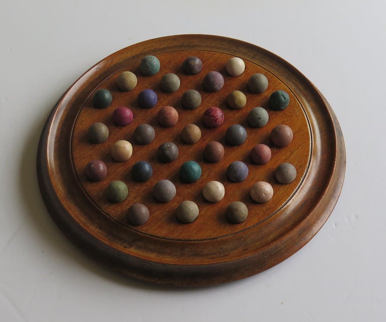 19th Century Victorian Marble Solitaire Game Hardwood Board 37 Handmade Clay or Stone Marbles For Sale