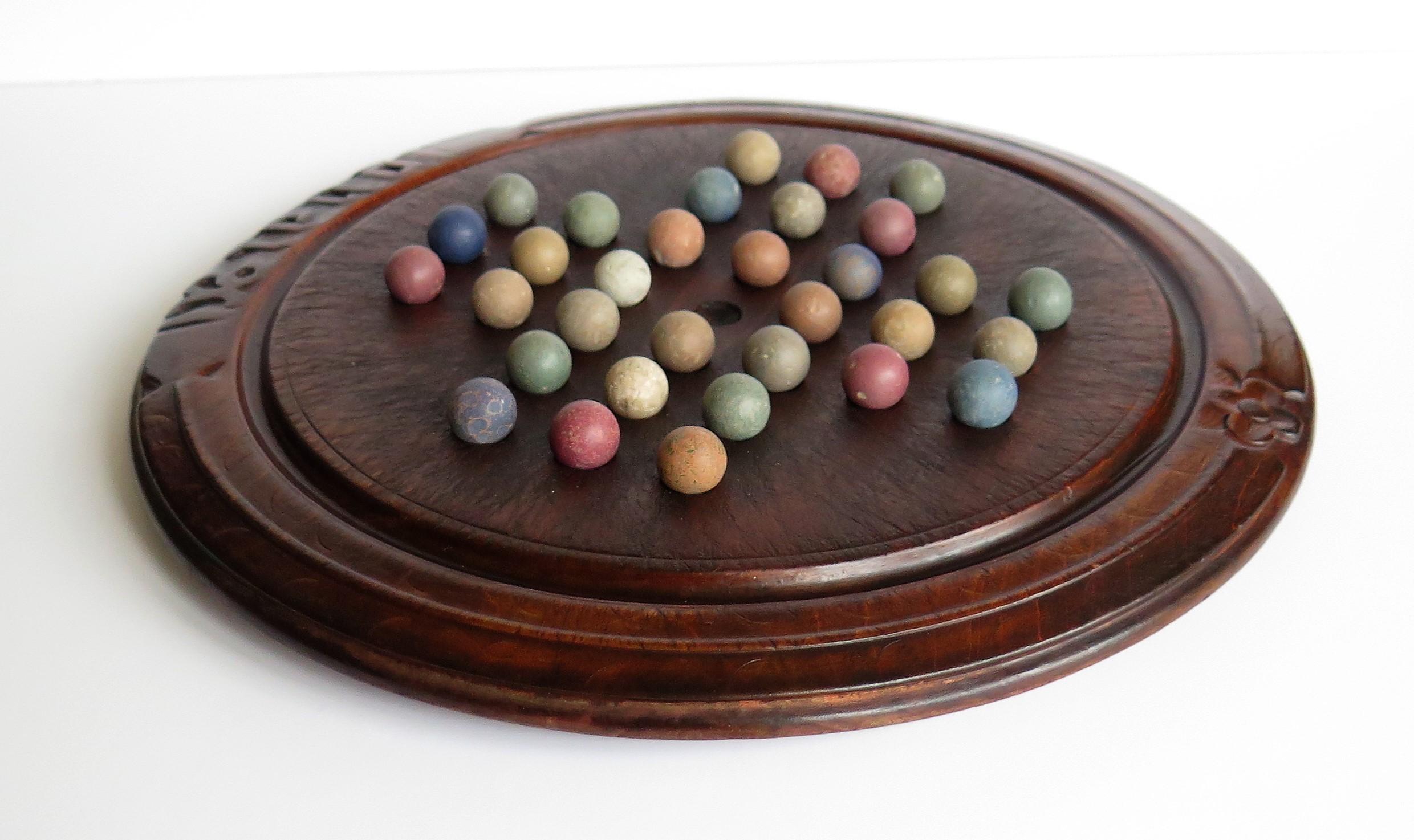 Victorian Marble Solitaire Game with Converted Folk Art Carved Breadboard In Good Condition In Lincoln, Lincolnshire