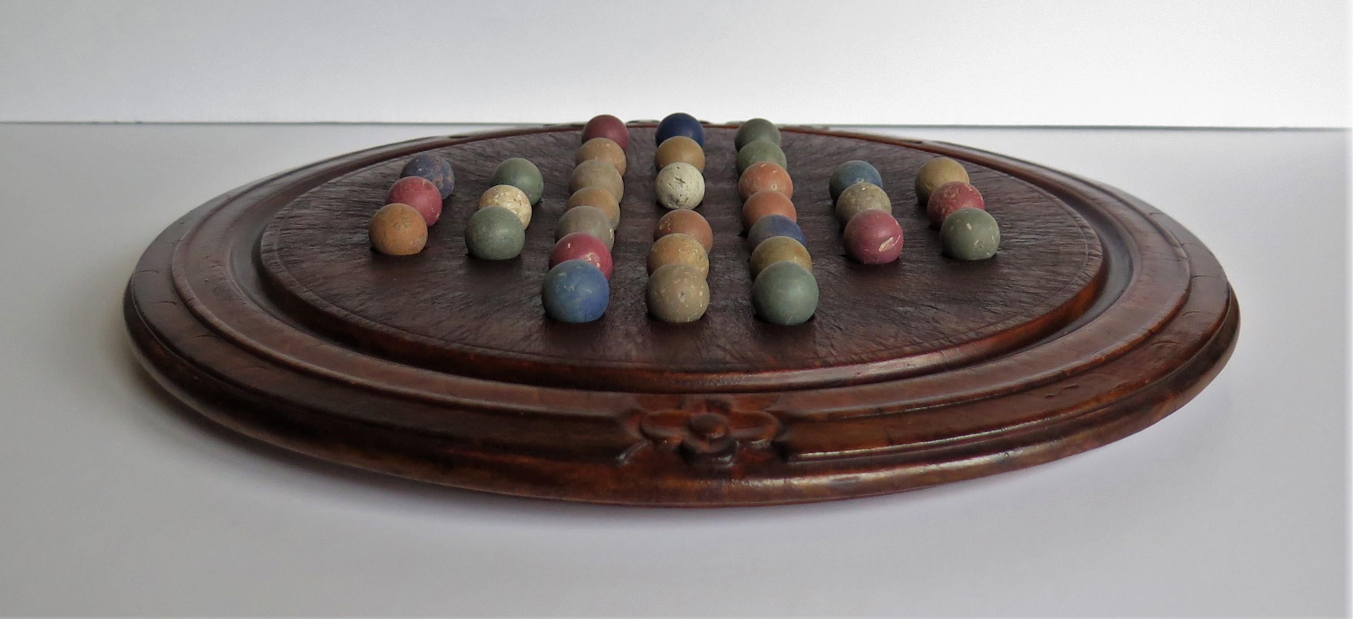 Stone Victorian Marble Solitaire Game with Converted Folk Art Carved Breadboard