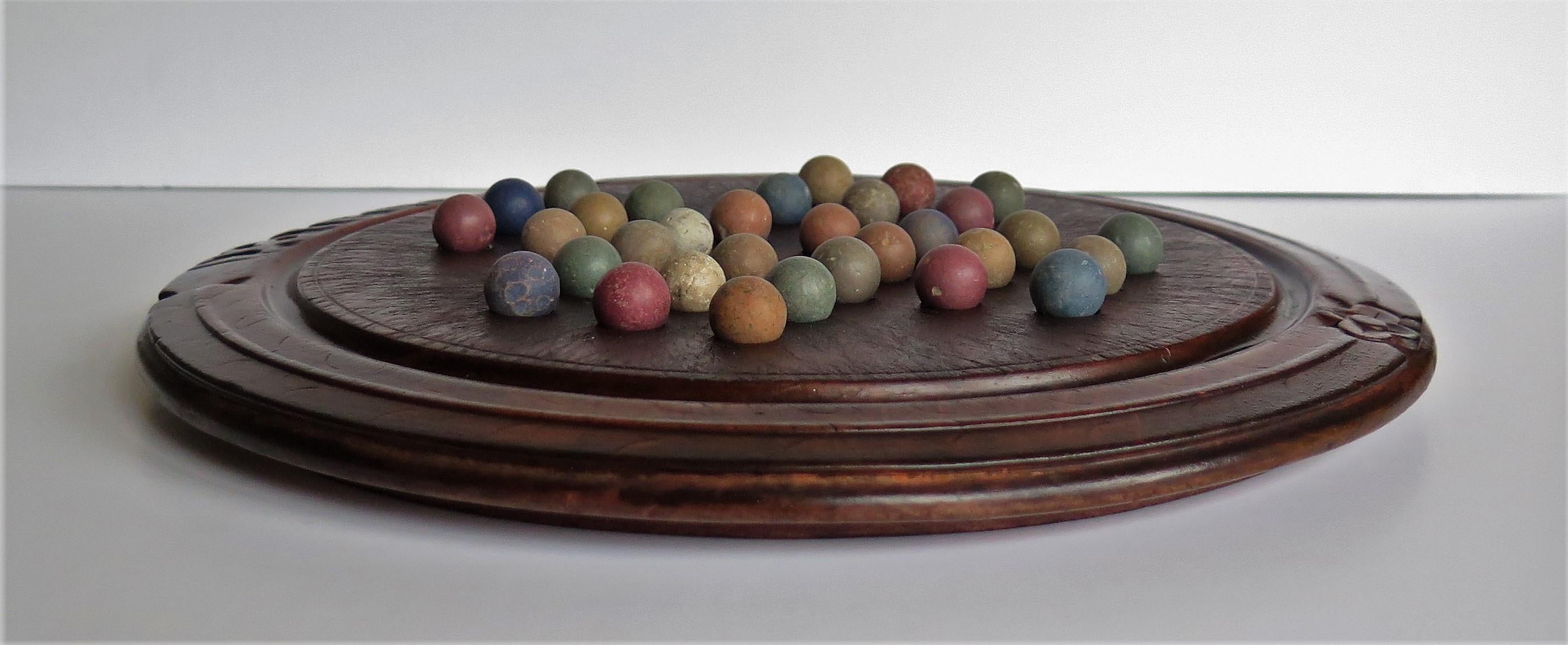 Victorian Marble Solitaire Game with Converted Folk Art Carved Breadboard 1