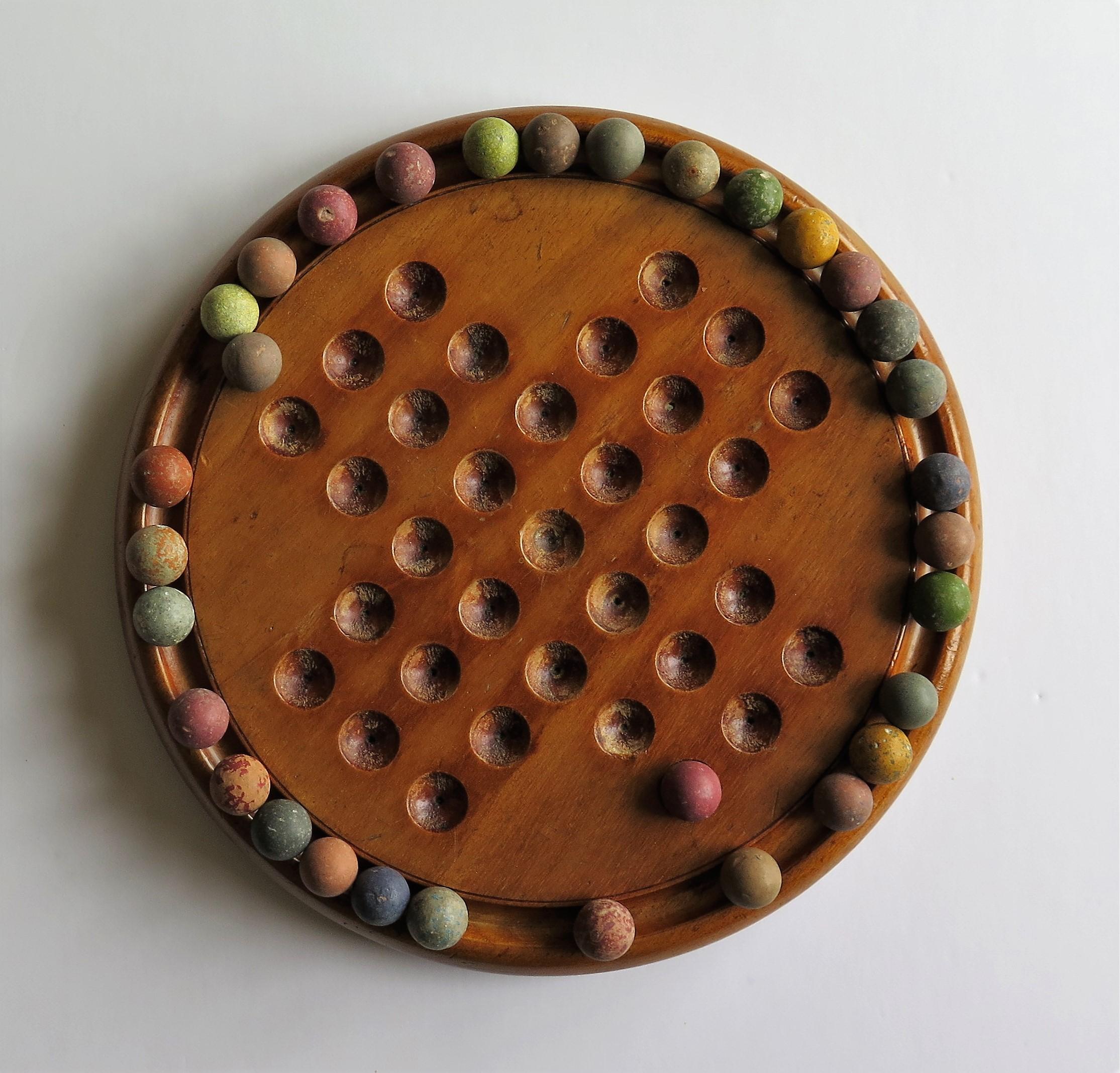 19th Century Victorian Marble Solitaire Game with Mahogany Board and 32 Handmade Marbles