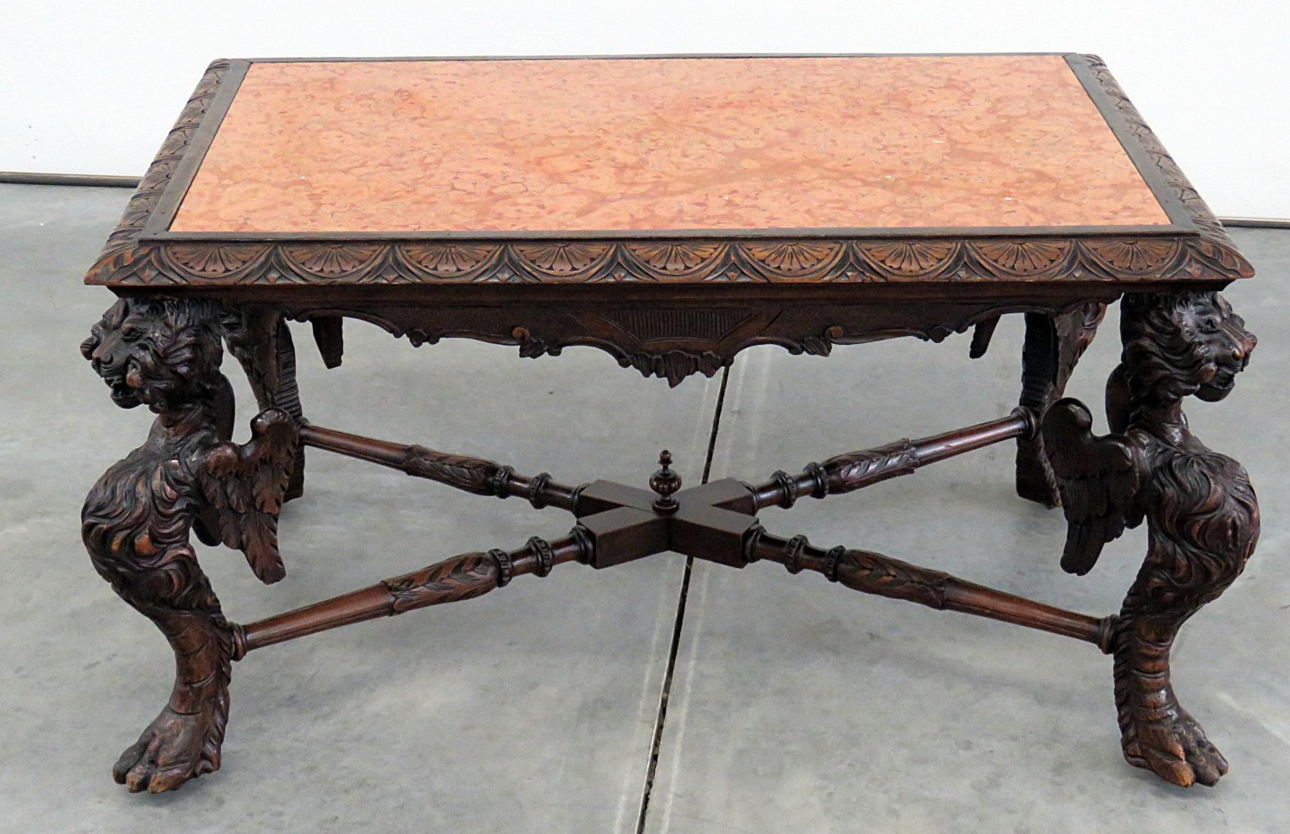 Victorian figural marble top coffee table with hairy paw feet.