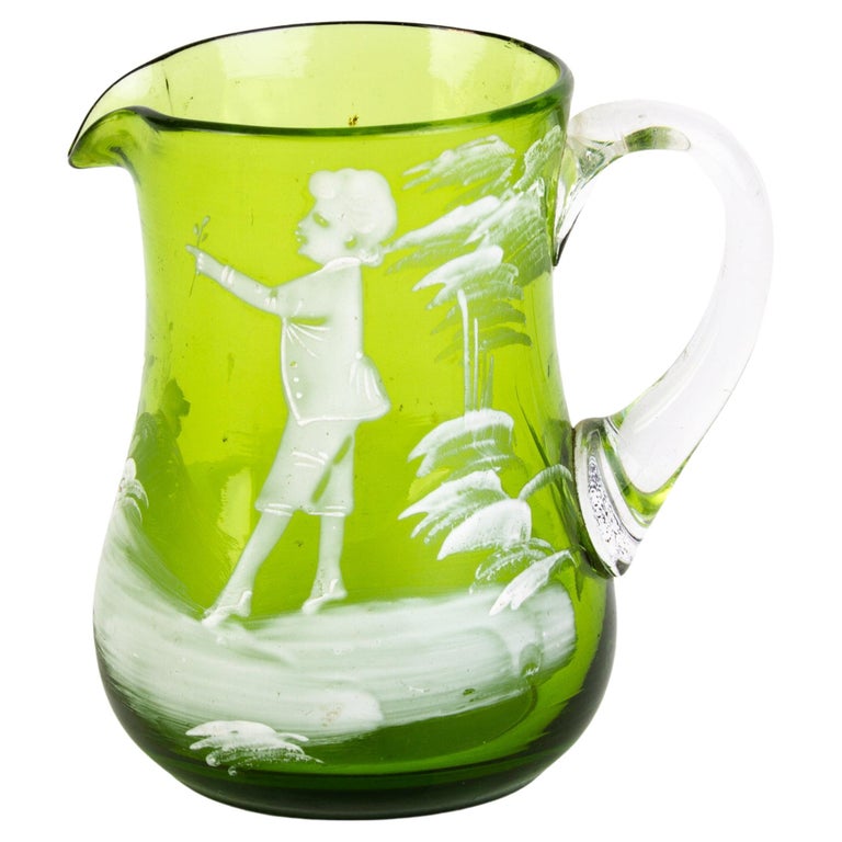 https://a.1stdibscdn.com/victorian-mary-gregory-green-enameled-glass-pitcher-jug-19th-century-for-sale/f_90032/f_355683121691195225620/f_35568312_1691195226505_bg_processed.jpg?width=768