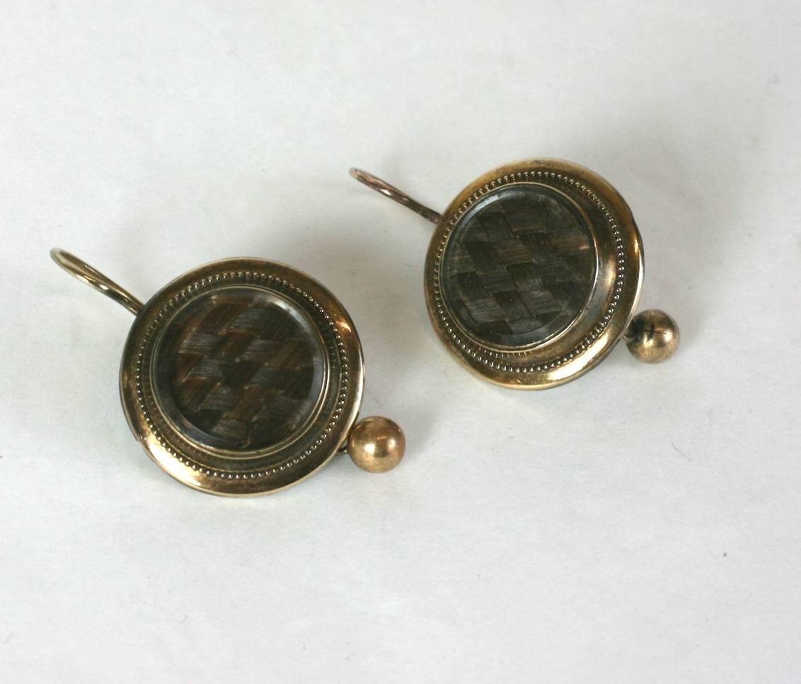 Victorian Memorial Hair Locket Earrings in 10k gold. Plaited hair is basket woven and set under glass. Wirework decoration around bezel.  1880's USA. 
Excellent condition. 
1