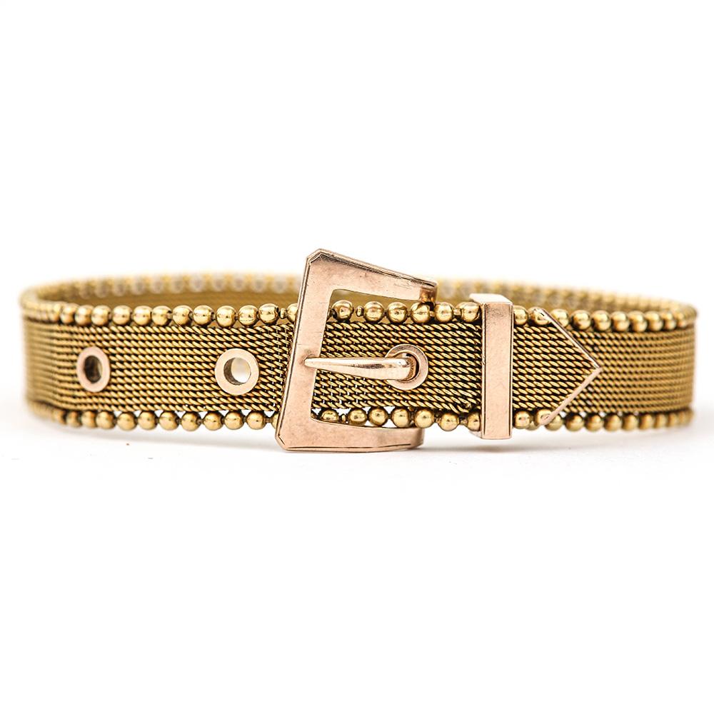 A fine example of a 9ct yellow gold woven mesh bracelet made circa 1880 during the Victorian era. It is modelled on a belt design which was a prevalent design in the period with buckle rings, bangles being produced using this popular symbol. This
