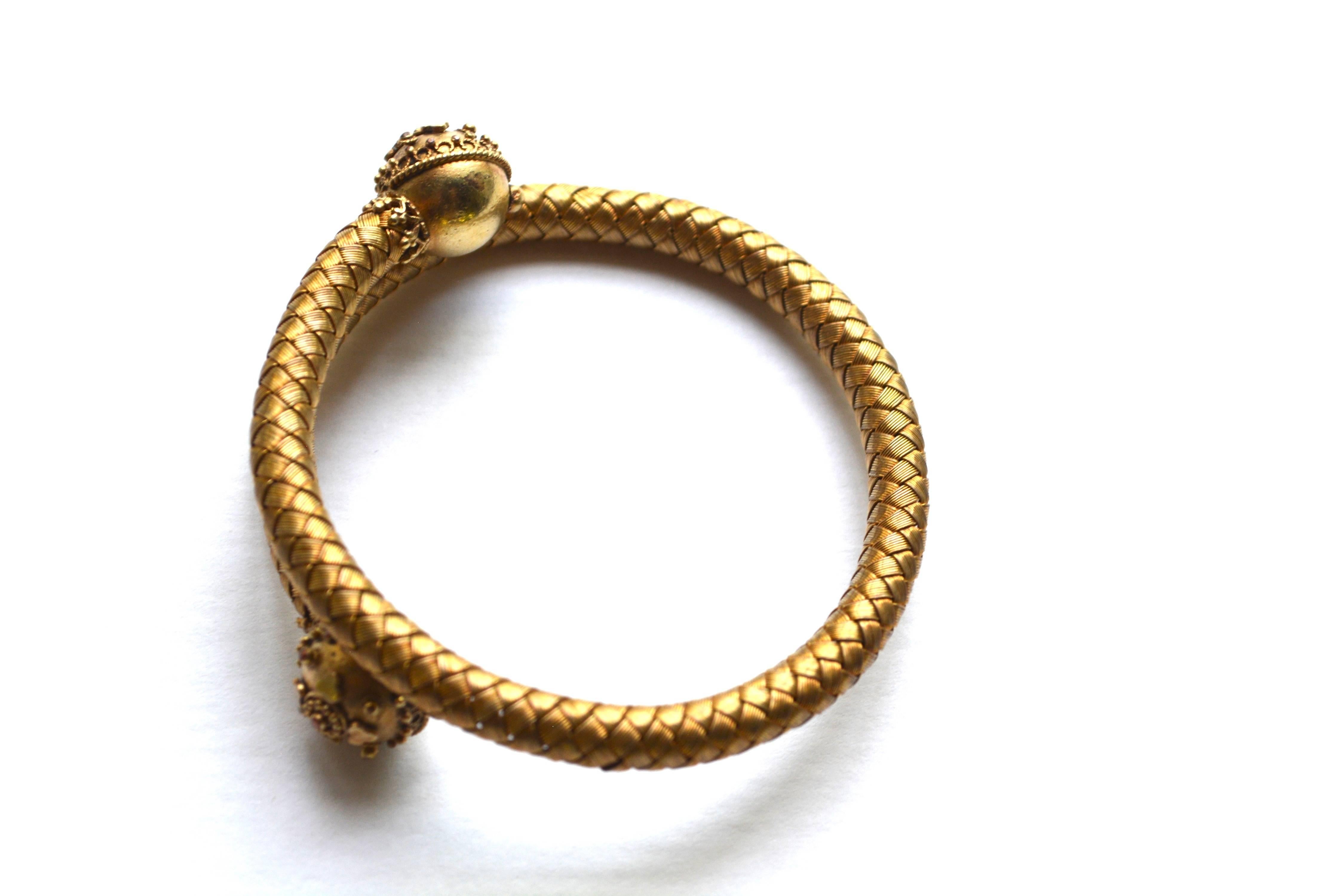 Lovely woven 1800s wrap bracelet made of 14k gold. Condition is excellent. Will adjust from about a 6.5