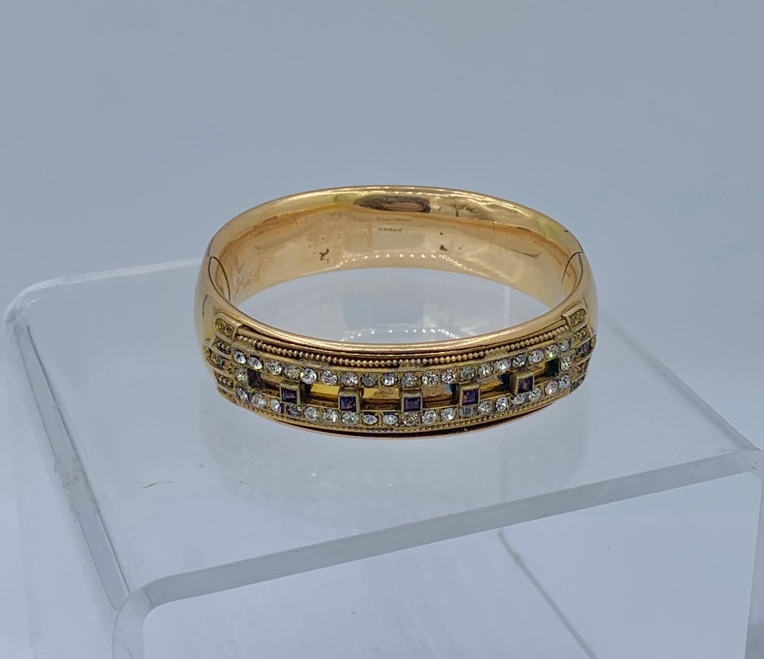 THIS IS A WONDERFUL ANTIQUE GOLD SHELL VICTORIAN - ART DECO BANGLE BRACELET MADE BY THE ESTEEMED JEWELERS MH & CO.  WITH EXQUISITE RHINESTONE AND AMETHYST PASTE GEMS IN A WONDERFUL ARCHITECTURAL DESIGN.  THIS IS A BEAUTIFULLY MADE HEAVY BRACELET IN