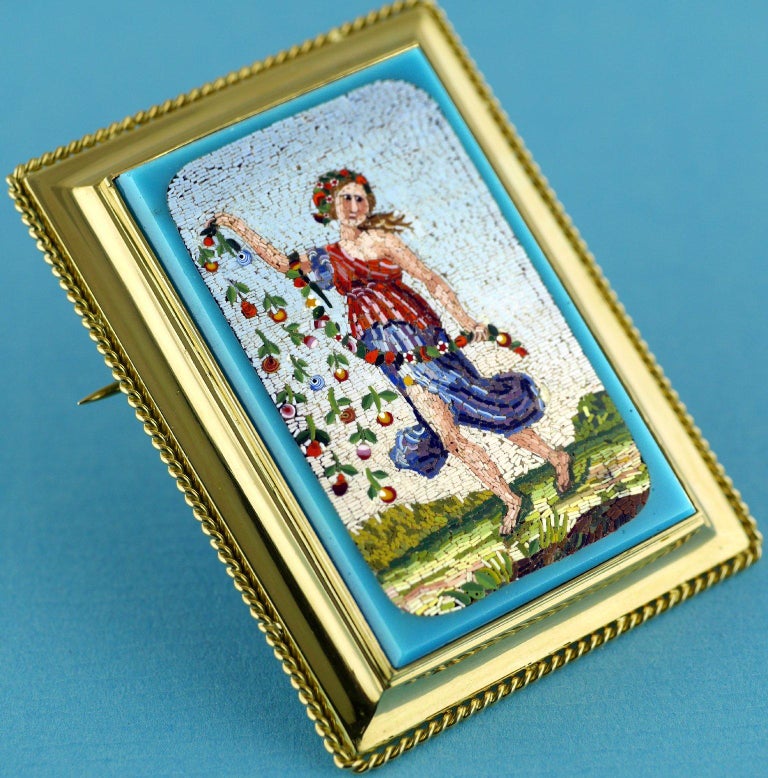 Fine quality micromosaic, depicting the Roman deity Flora, the goddess of Spring & flowers, set as a brooch in 18ct gold. 

Very similar, in style, to the work of Antonio Aguatti who worked in Rome in the first half of the nineteenth century. 

The