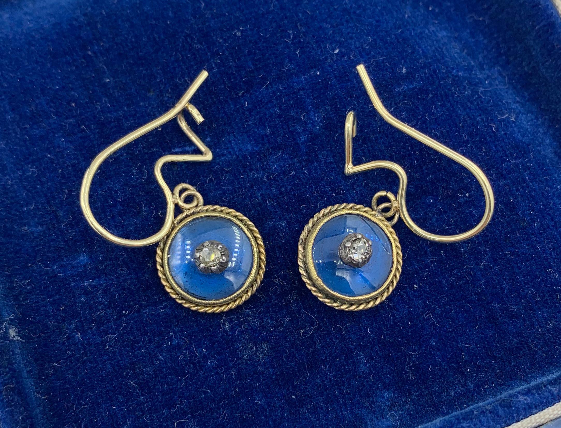 This is a stunning pair of Victorian to Art Deco Dangle Drop Earrings set with fabulous Old Mine Cut Diamonds in the center of Royal Blue Enamel circles in 14 Karat Gold.  The early earrings have Old Mine Diamonds which are set in cut down collets