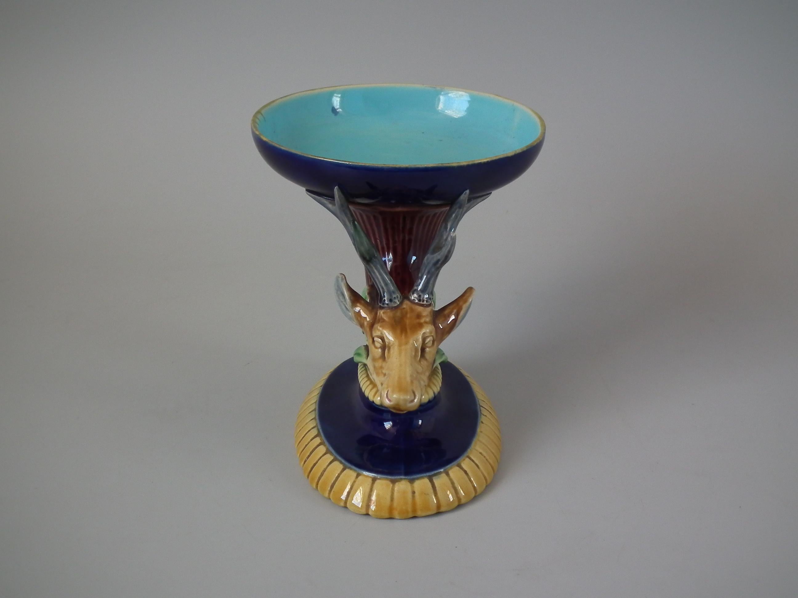 Minton Majolica compote which features a stag's head. Colouration: cobalt blue, turquoise, ochre, are predominant.