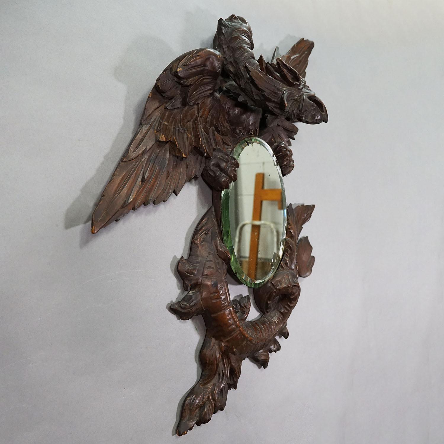 Victorian Mirror with Carved Dragon in the Manner of Gabriel Viardot ca. 1880

A great Victorian dragon mirror in the style of Gabriel Viardot. The mirror in oval shape is held by a wooden winged dragon. Manufactured in France ca. 1880. Very good