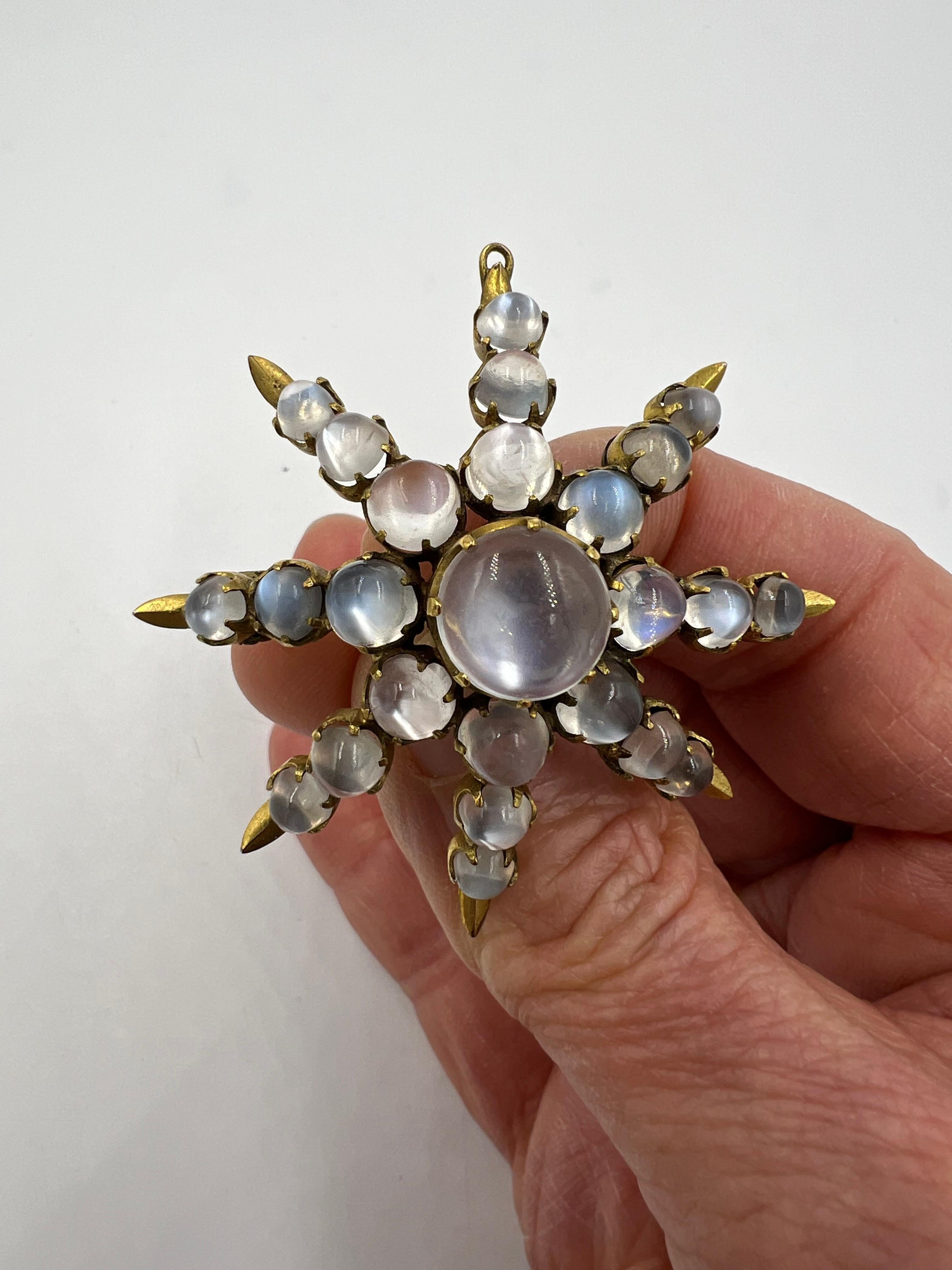 Victorian Moonstone Brooch, circa 1890.

  This extraordinary, large brooch is set with 25 beautiful round cabochon moonstones. Each showing off their adularescence (which is moonstone's unearthly glow caused by light scattering between microscopic