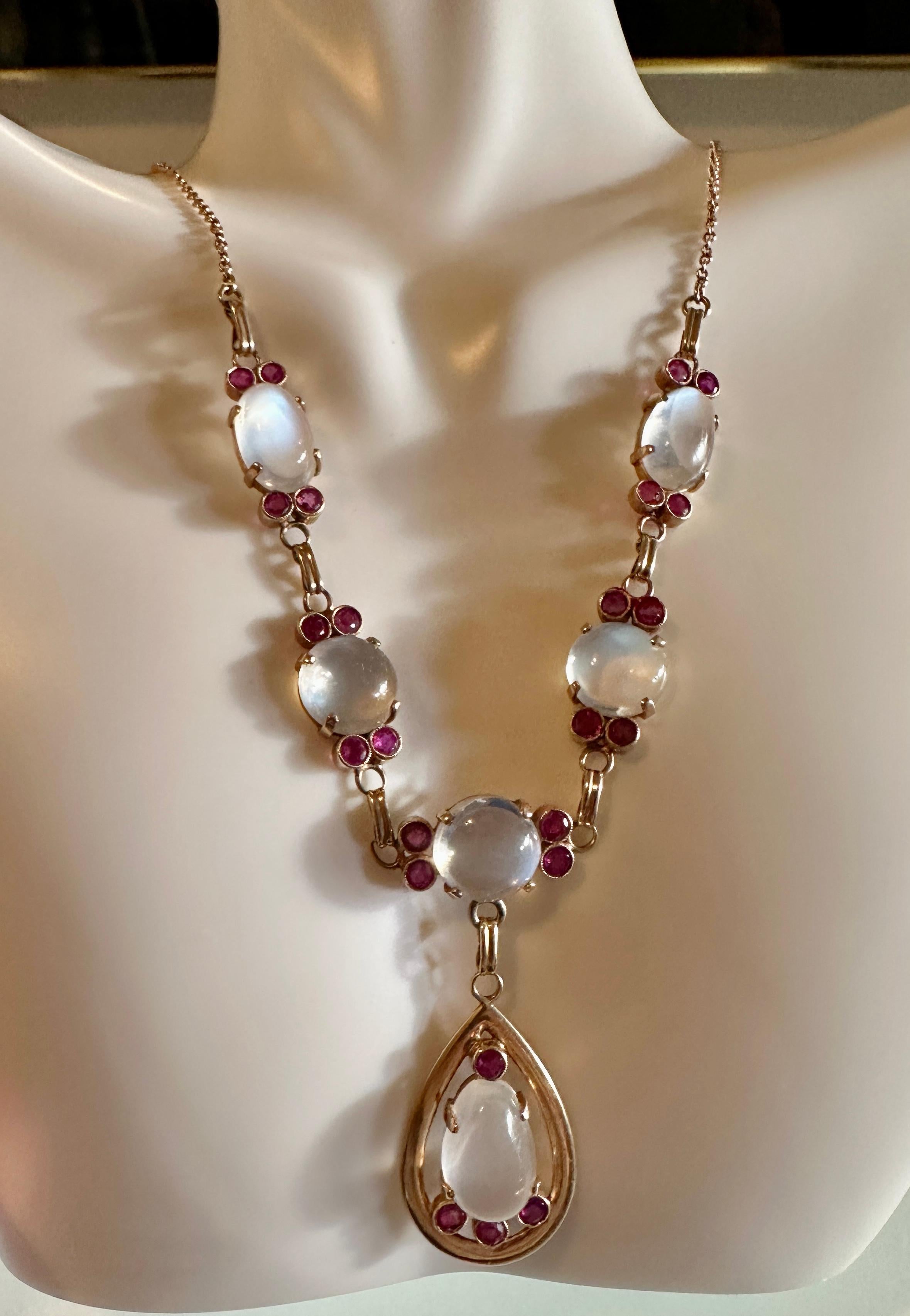 THIS IS A MAGNIFICENT MUSEUM QUALITY ANTIQUE VICTORIAN MOONSTONE AND RUBY NECKLACE IN 14 KARAT ROSE GOLD. 
The necklace is an absolute masterpiece of antique Victorian jewelry artistry.  The combination of moonstone, ruby and rose gold in the