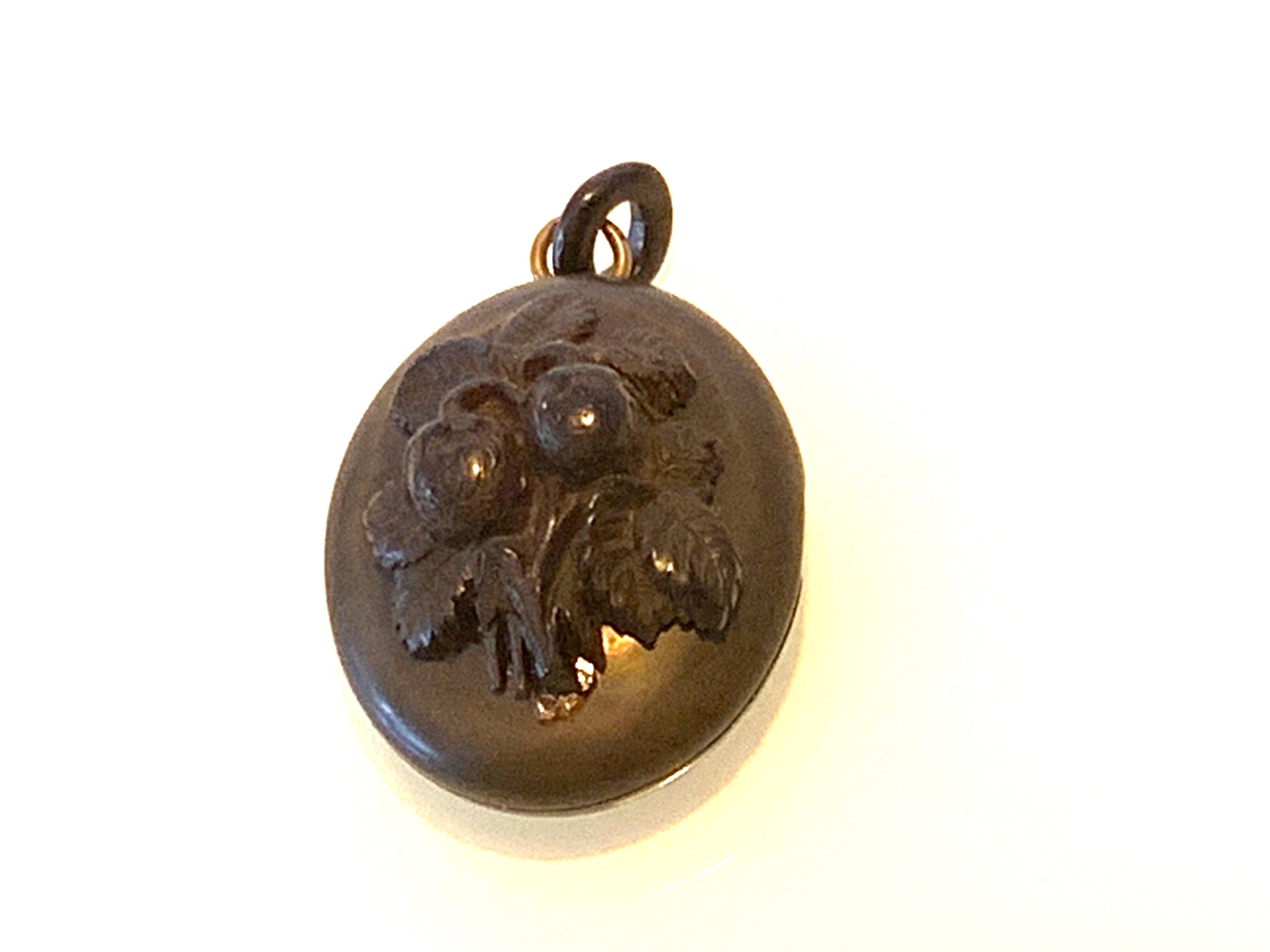 Rare Beautiful Victorian Vulcanite Mourning Locket
which has a missing top half of side hinge cover missing - and therefore comes apart as two sections 
But saying this the two pieces cleverly snap together and are extremely secure
and the issue