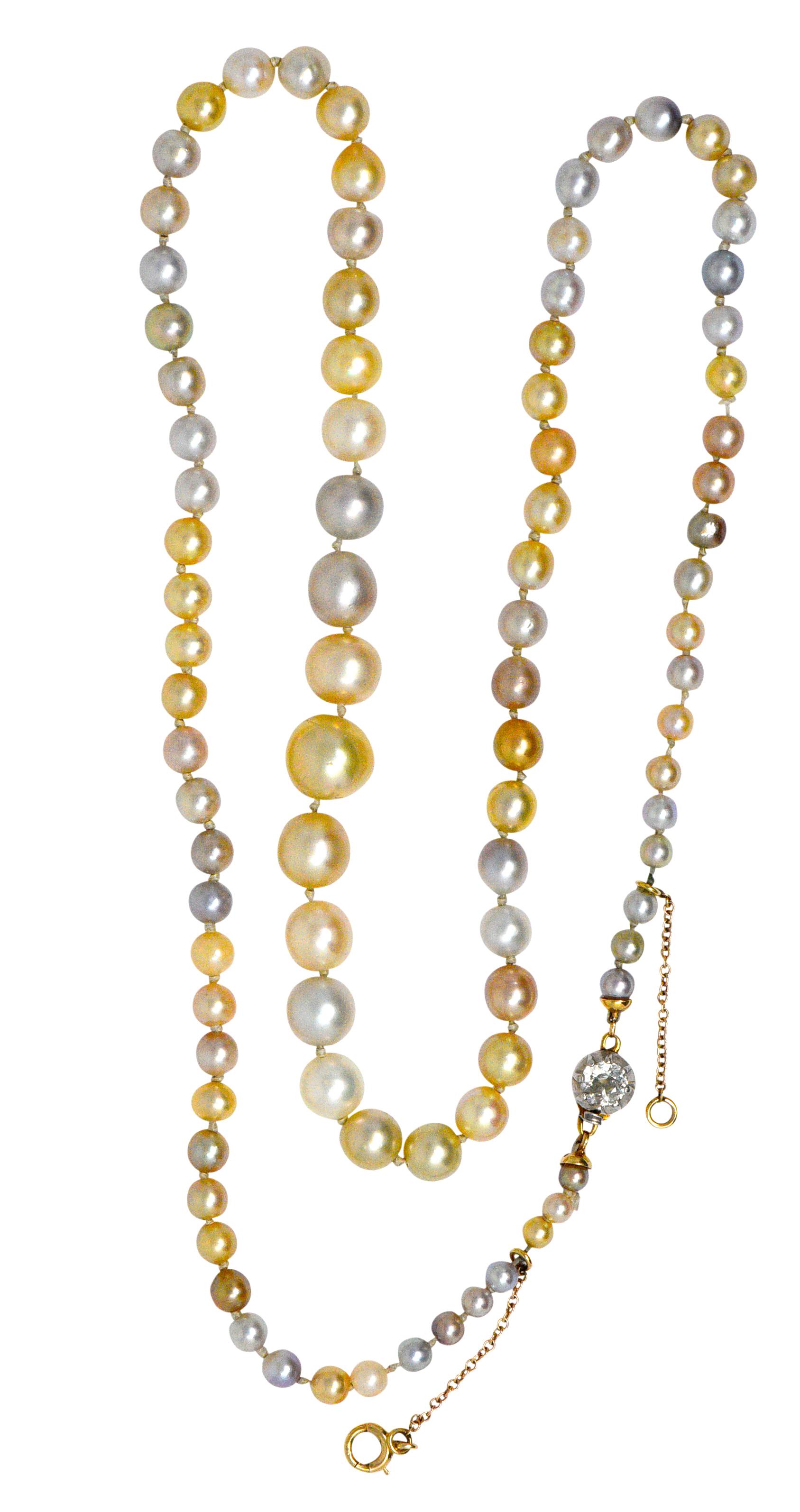 With 91 graduated natural pearls measuring 2.98 to 8.52 mm, variously colored, variously shaped some with orient

87 pearls tested to be saltwater formed, 4 freshwater formed and from the Unio mollusks 

Completed by a old European cut diamond,