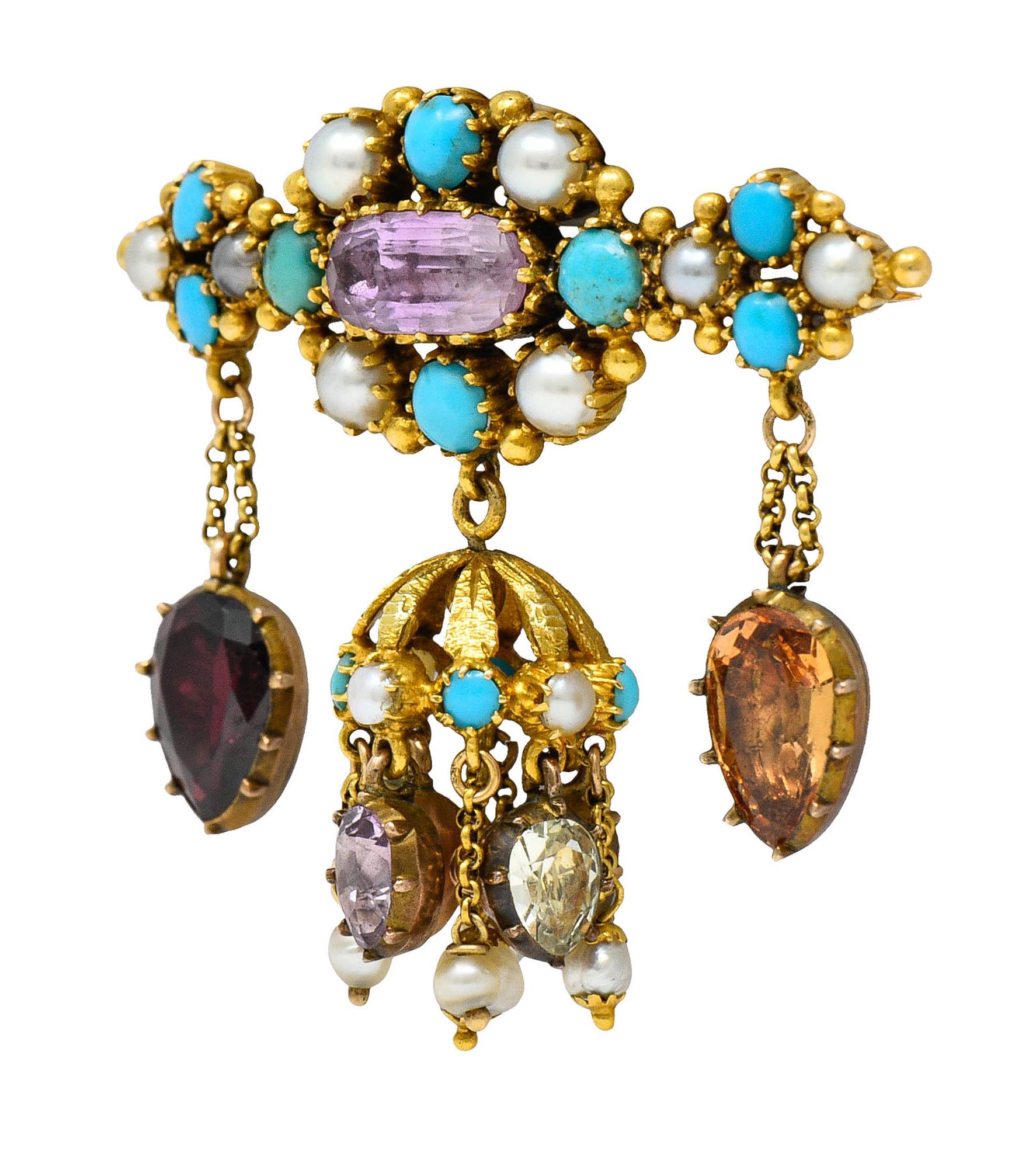 East/West brooch features an elongated cushion cut topaz

Measuring approximately 10.1 x 4.8 mm with medium light pinkish lavender color - foil backed

Surrounded by round button pearls and round turquoise cabochons

Varied in color and luster while