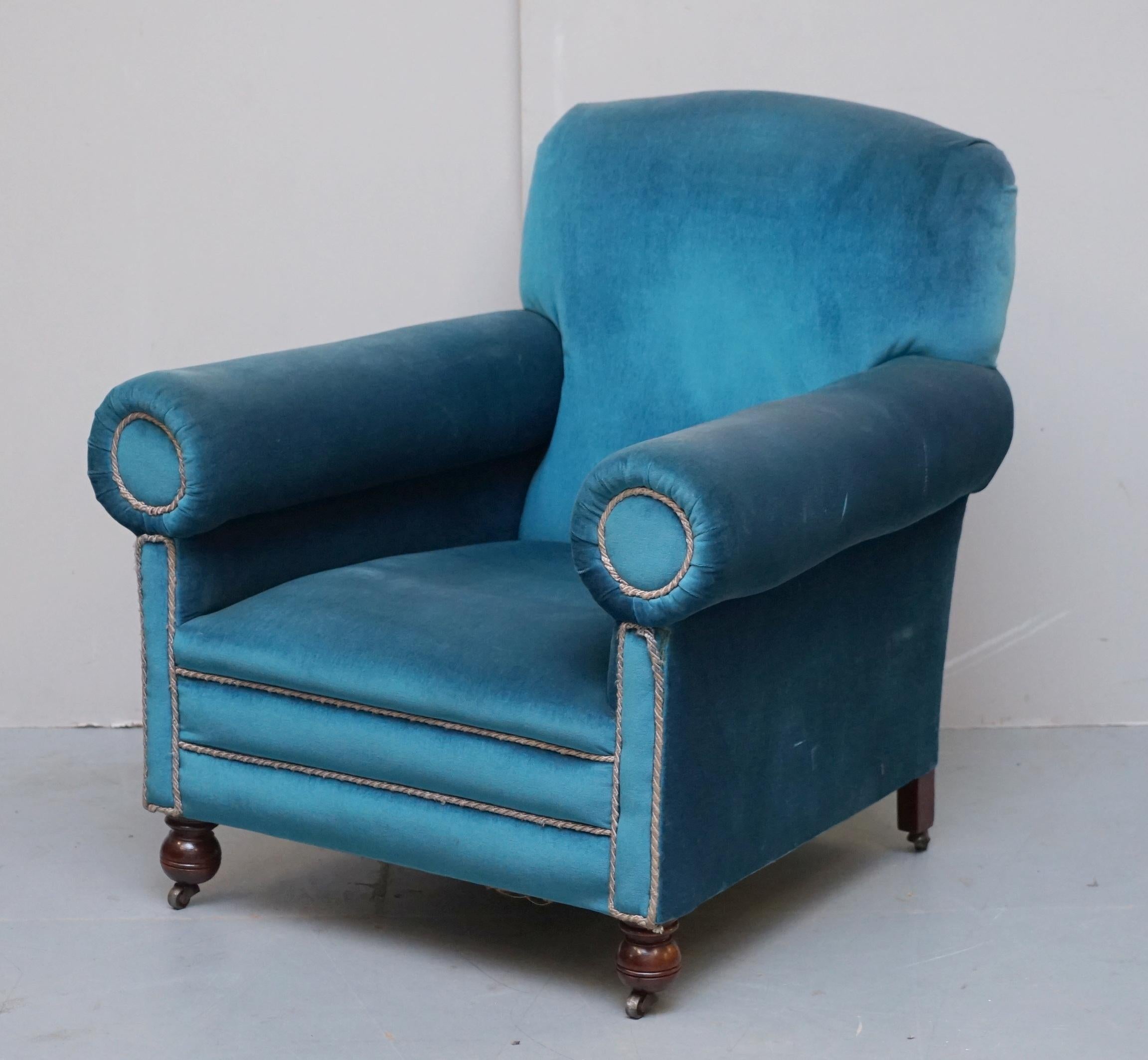 We are delighted to offer this stunning pair of original Victorian circa 1880 club armchairs with bolster arms upholstered in Napoleonic blue velvet made by Maple & Co London

A good looking and well made pair of armchairs with vintage blue velvet