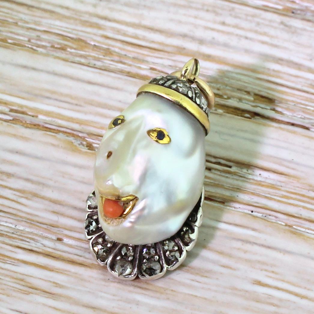 Admittedly, this is one you either love or loath – and we absolutely love it! The unusually shaped natural (saltwater) pearl has been creatively formed into a jester’s head. His skullcap is set with fourteen cut diamonds in silver. Blue sapphire