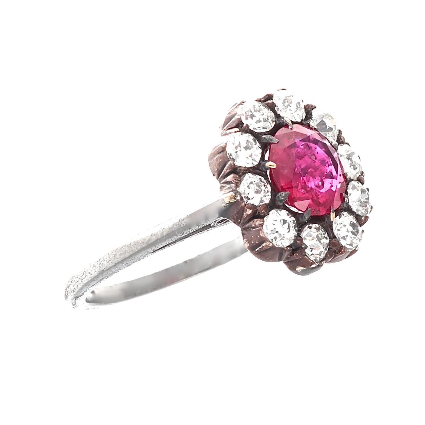 Designed after a blossoming flower the halo ring is the most popular modern design for engagement rings and has been a staple for centuries. Featuring a 1.31 carat vivid red ruby that is AGL certified as Burma origin with no indications of heat